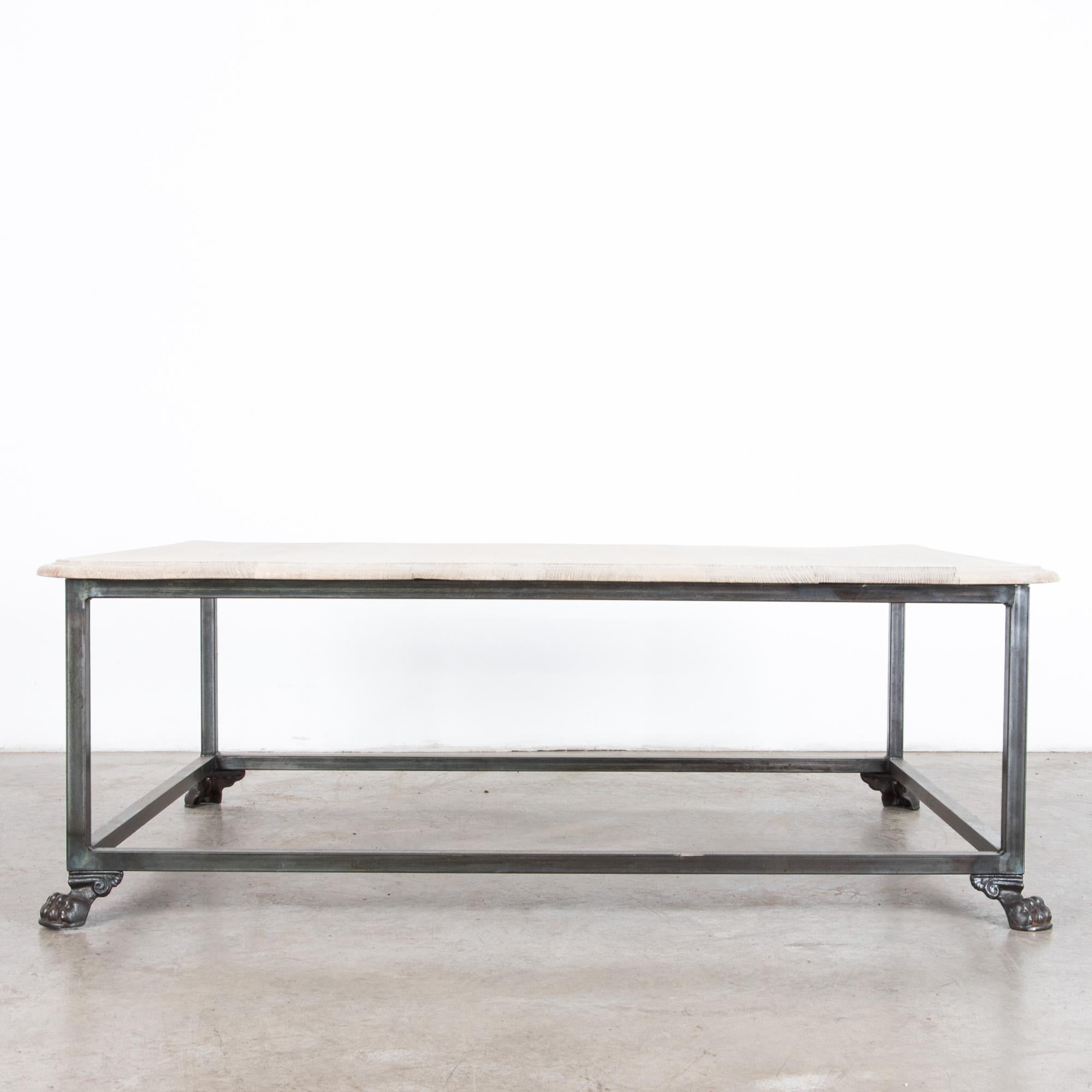 Composed from reclaimed furniture elements, an antique oak tabletop, and iron claw feet are recast as a stylish and contemporary coffee table. Decorative embellishment and an elegant tabletop profile add ornamental flair to a minimal shape.