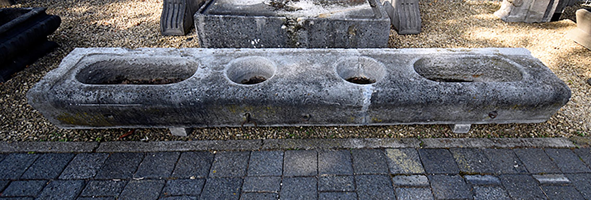 This antique Belgian bluestone horse trough 19th century comes
from a Belgian farm where horses used it to drink out of.
It still has the original hooks to tie up the horses.