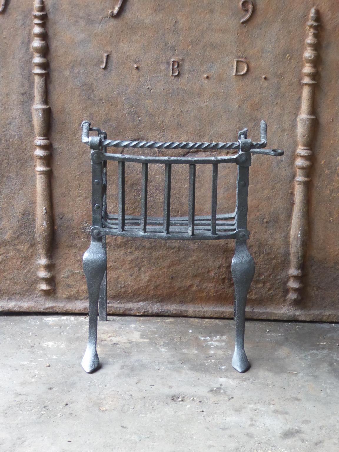 Fine hand-forged Louis XV fireplace basket or fire grate. The condition of the grate is good.



















  