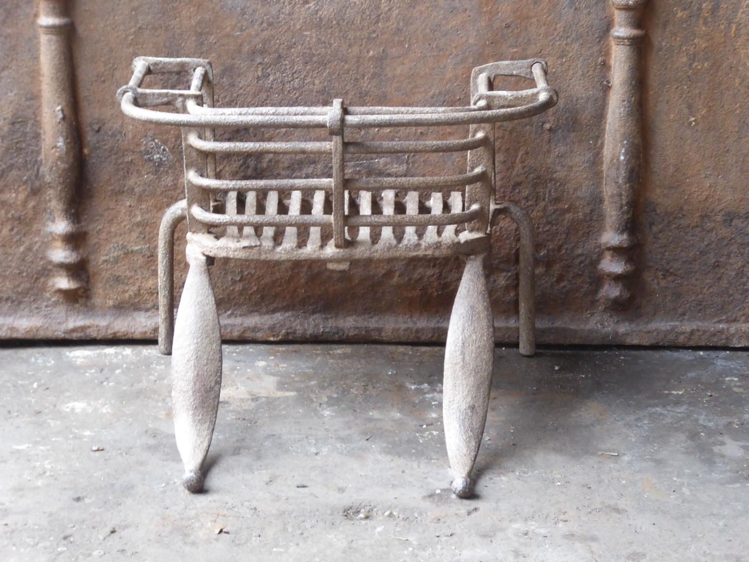 Beautiful hand-forged Louis XV fireplace basket or fire grate. The condition of the grate is good.



















  