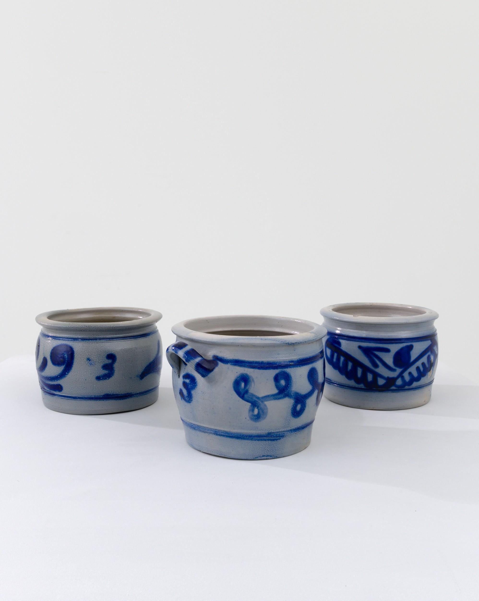 These three typical country pots are finished with a distinctive vivid blue salt glaze, enhancing the rounded clay base with a charming nature inspired motif. The dominant form of storage for food or agricultural purposes for thousands of years,