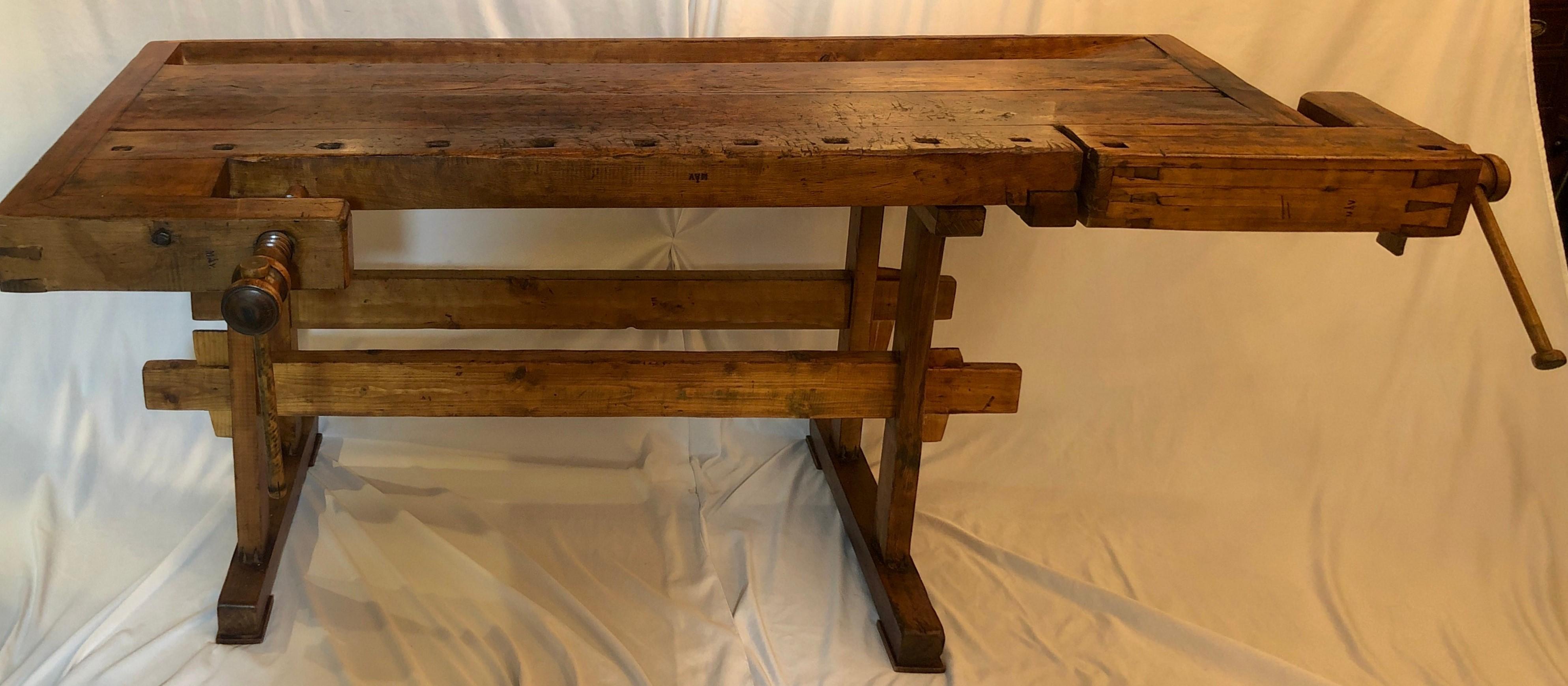 Antique Belgian Solid oak carpenter's woodworking bench with 2 vises, Circa 1900-1910.

Measures: Height - 34 inches
Width - 84 inches
Depth - 38 1/2 inches
Depth Of Surface - 32 1/2 inches.