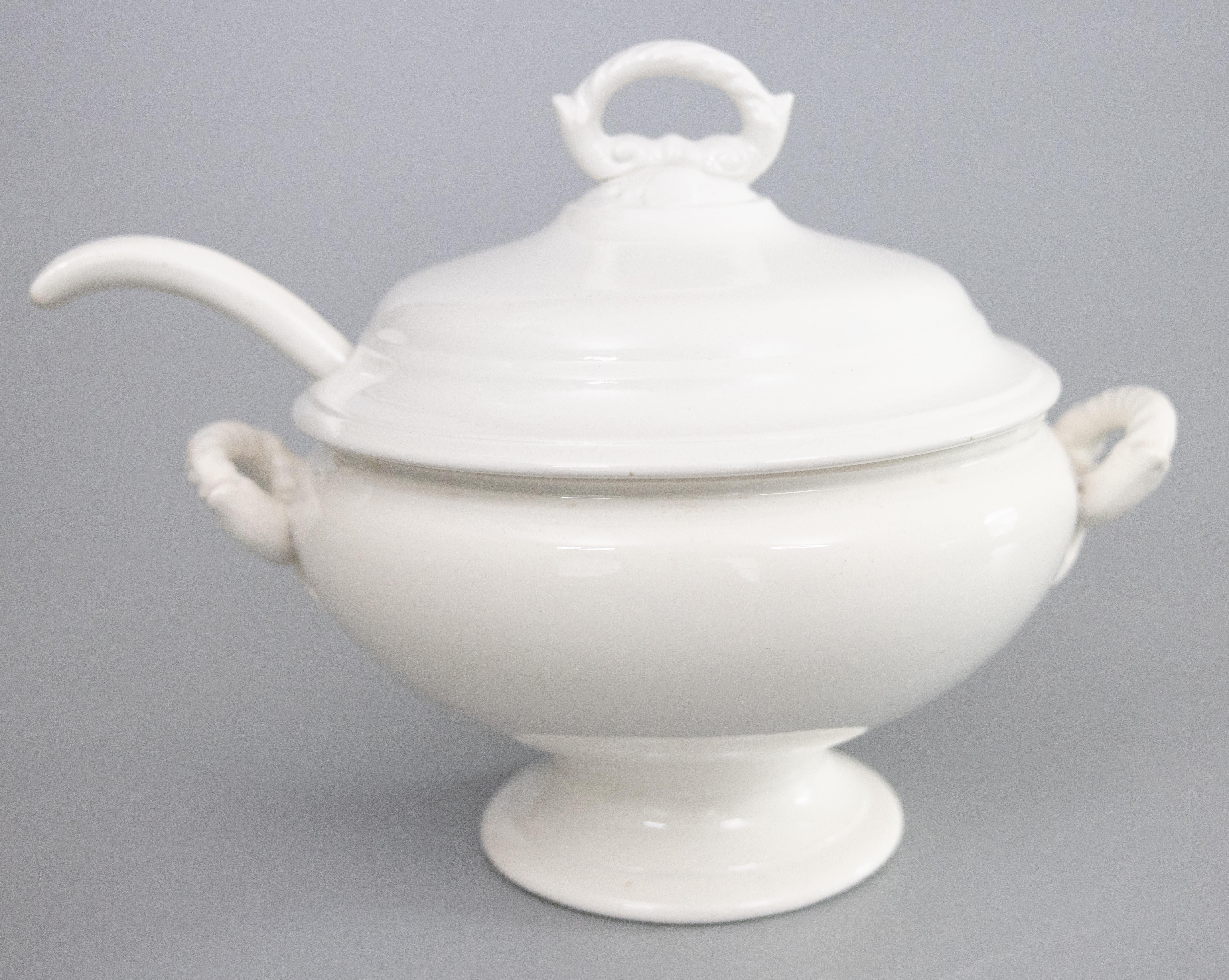 A gorgeous antique white ironstone lidded soup tureen and ladle made by Boch Frères in La Louvière, Belgium, circa 1920. Maker's mark on reverse. The ladle is marked 