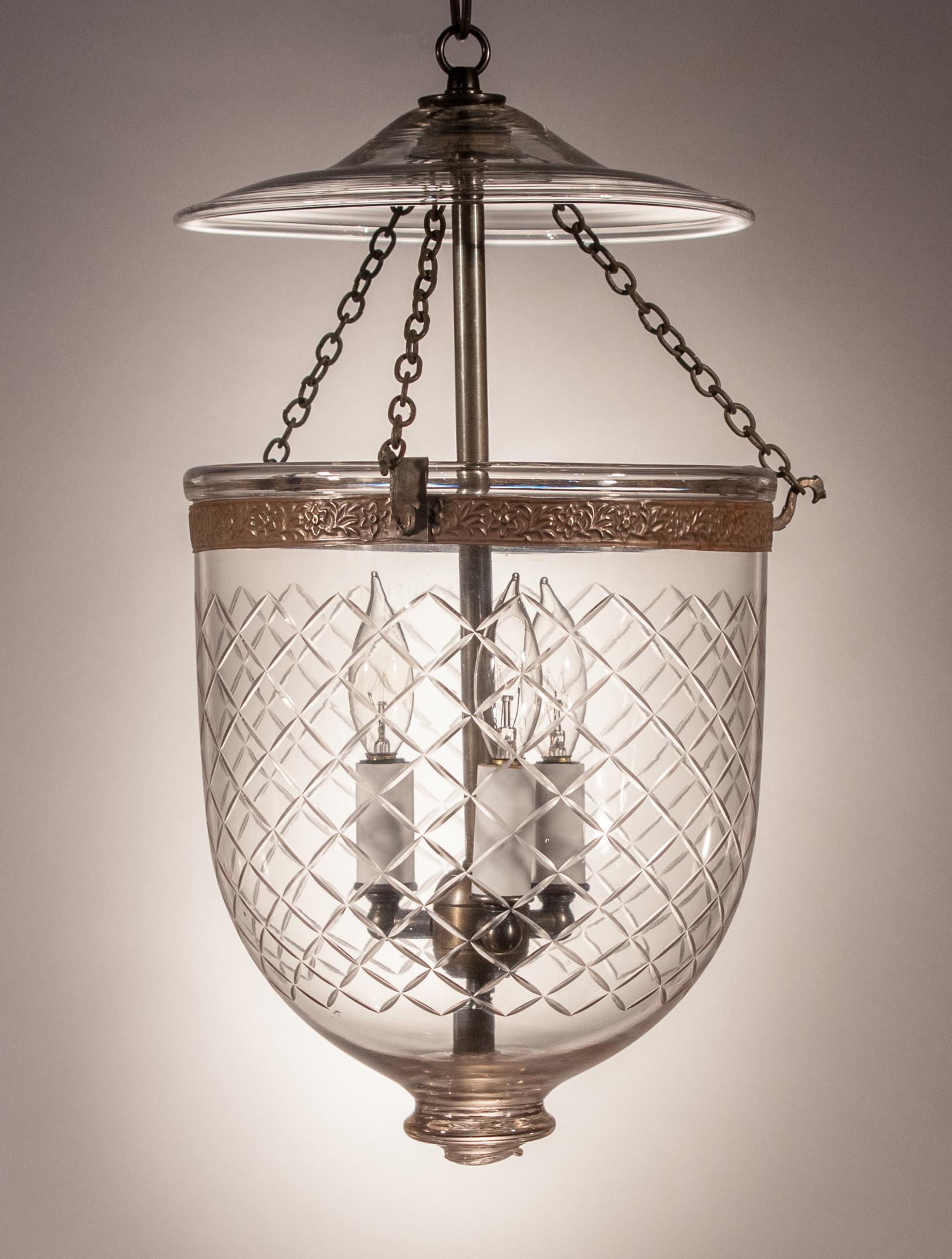 A lovely antique bell jar lantern manufactured by S&C Bishop, England, circa 1890. The Bishop indicia appears on both the hand blown glass jar and pontil, which is rare. The Waterford-style diamond etching is a nice complement to this petite