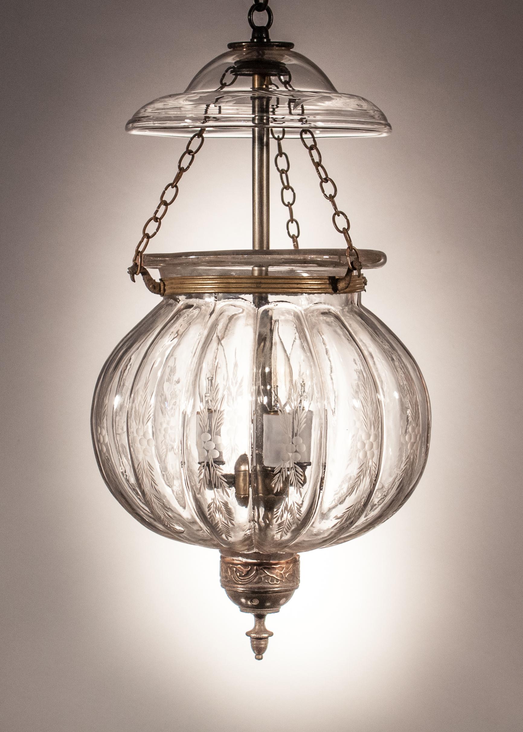 An exceptional melon or pumpkin bell jar lantern with wheat etching manufactured by Val St. Lambert, Belgium. This rare circa 1890 lantern features all-original fittings, including its pressed smoke bell/lid with a complementary etching, rolled