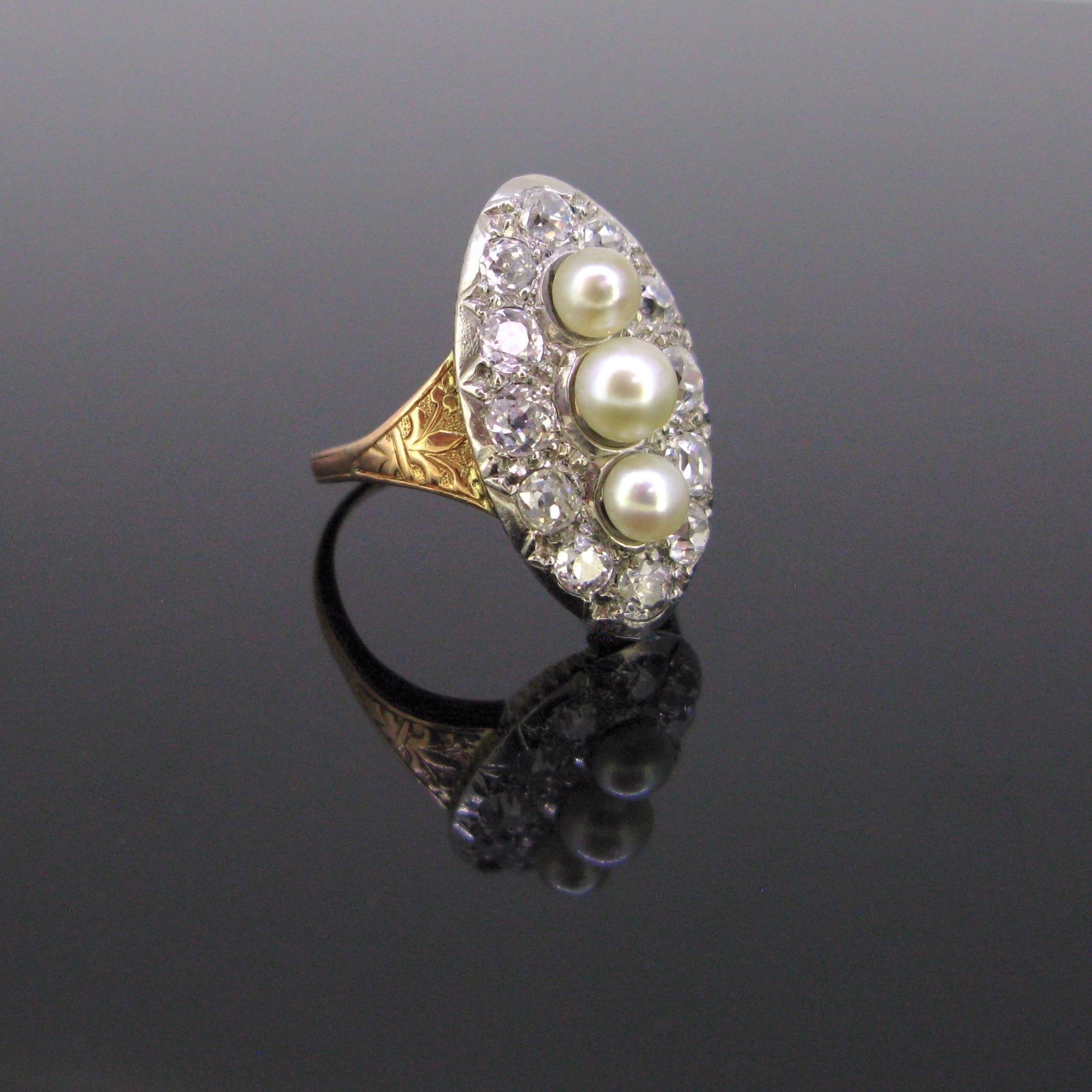 Weight:	7.70gr

Circa:	Belle Epoque

Metal:	18kt rose and yellow gold 
	Platinum

Stones:	3 naturals pearls
•	Diameter:	4.61 / 5.30 / 4.54 mm of diameter
	 
Others:	12 Diamonds
•	Cut:	Old mine
•	Total carat weight:  	2.50ct