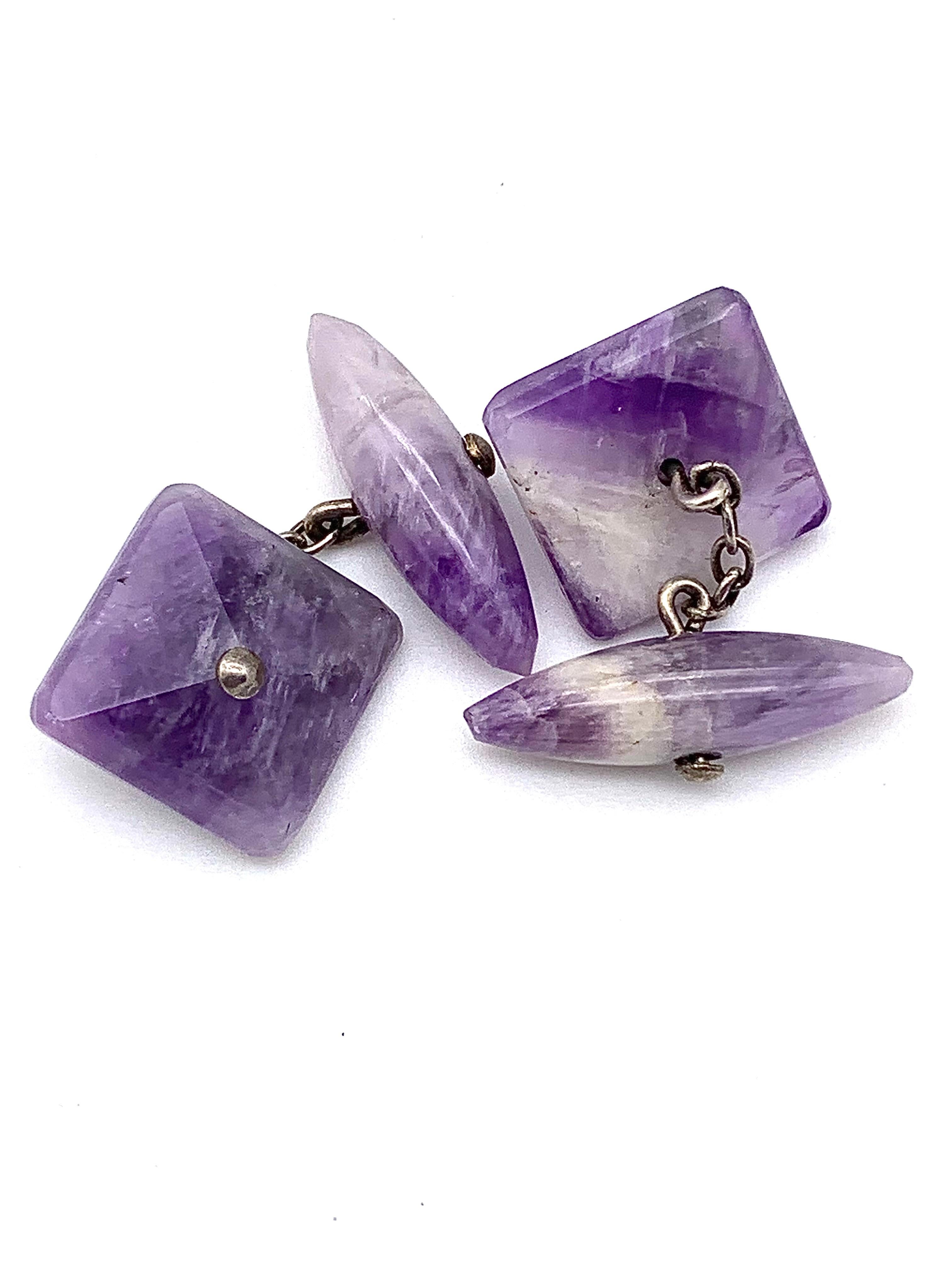 These elegant cufflinks were handcrafted around 1900.
On one side the cufflinks feature banded fluorite cut in the shape of pyramids, the complementary elements are cut in bullet shape. The two elements have been drilledand fitted with silver rivets