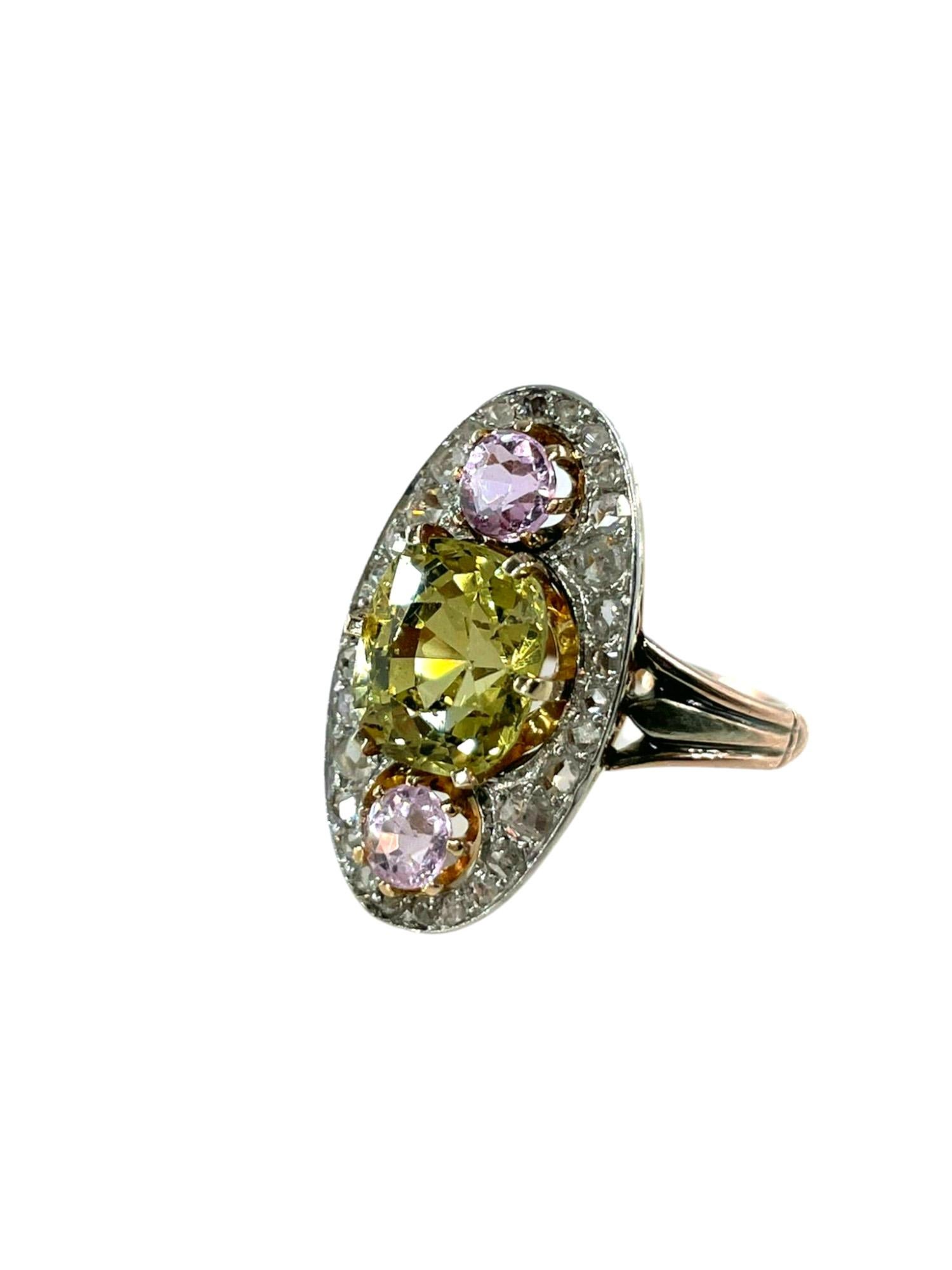 A beautiful Chrysoberyl and Pink Topaz Diamond ring from Belle Époque (ca1910) era!

Featuring a magnificent, dazzling bright green Old European Chrysoberyl, 2 Old European Pink Topazes and twinkling old Rose cut diamonds in this classic Navette