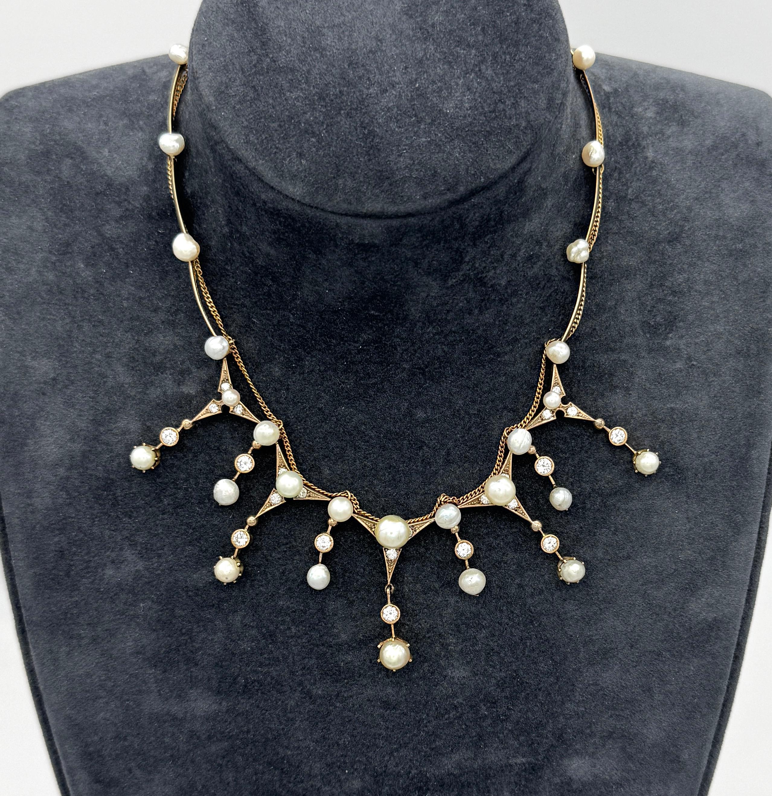This delicate necklace was handcrafted in the last decade of the 19th century. It is made out of gold, diamonds and a variety of pearls. There are natural sweet water pearls, natural saltwater pearls and cultured salt water pearls. The necklace is