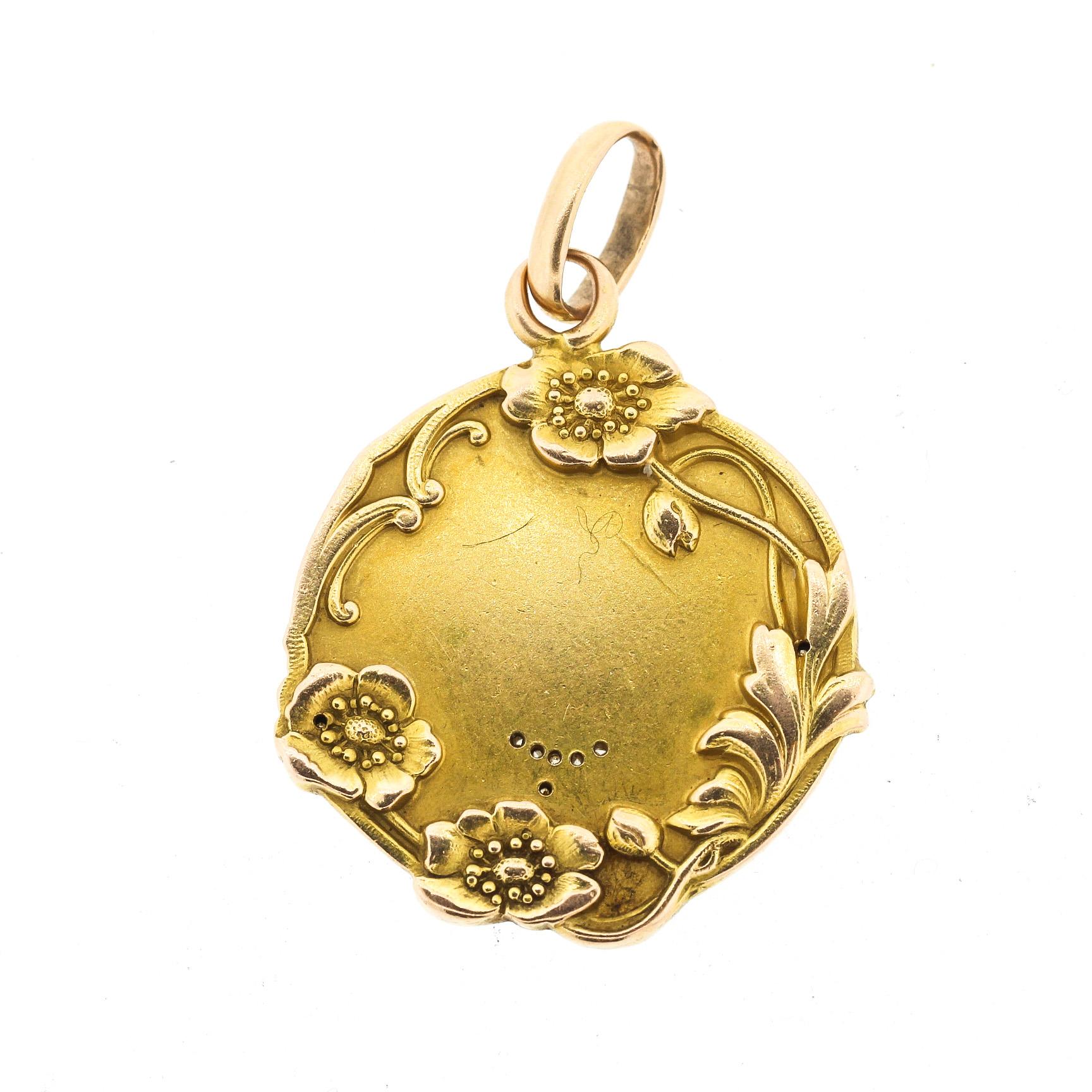 Antique 18k gold repousse pendant by famed French medal maker Jean Baptiste Emile Dropsy, circa 1900. Emile Dropsy was born in 1843 and died in 1923, and was a noted engraver and metal worker. This beautiful pendant depicts an Art Nouveau era woman