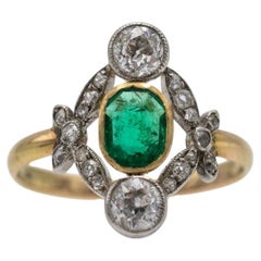 Vintage Belle Epoque gold ring with emerald and diamonds, France.