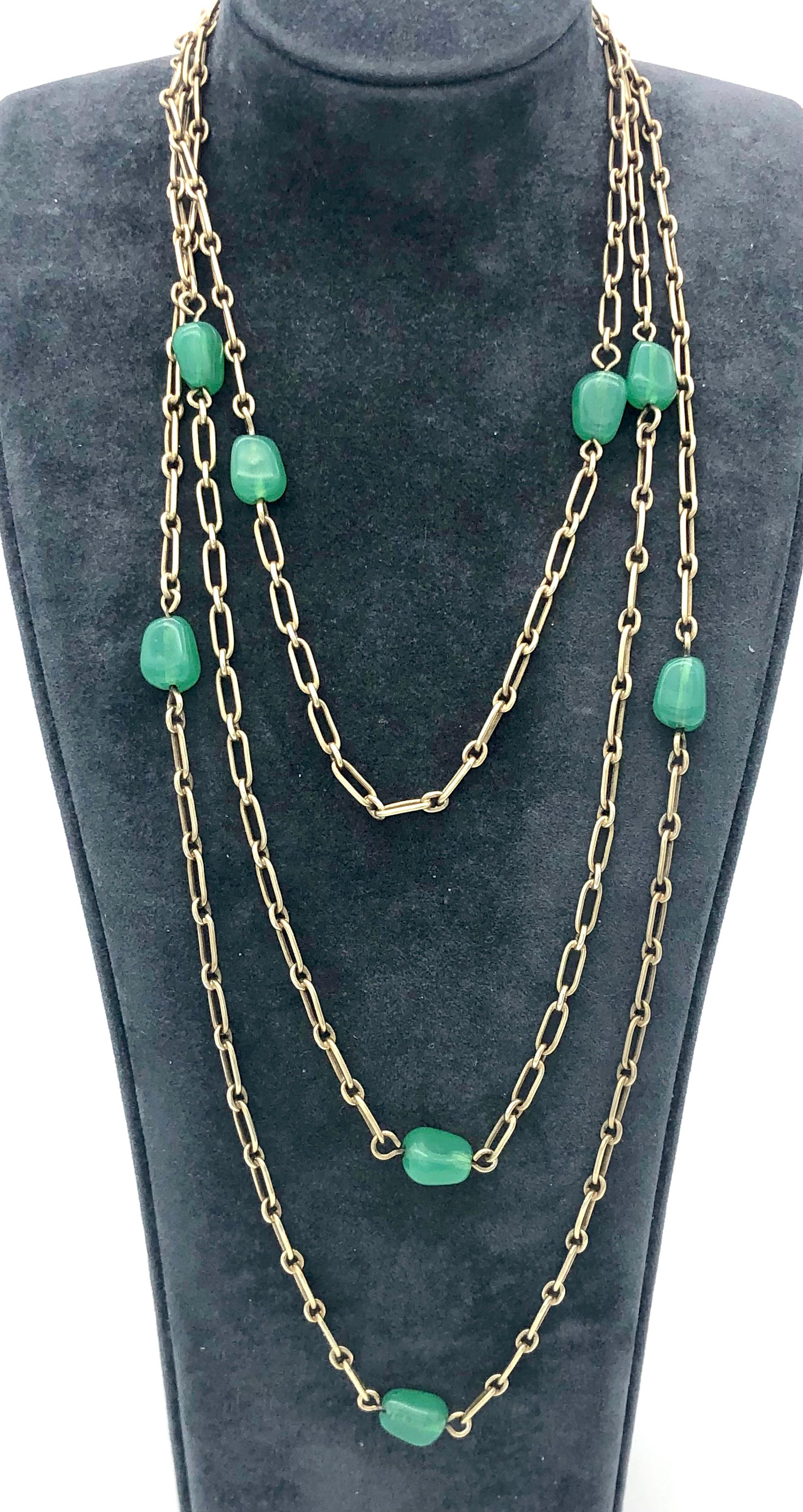 This elegant long guard chain is made was crerated towards the end of the 19th century. from long narrow oval links joined by smaller  oval links. Ten pebbles made out of chrysoprase are worked into the chain.