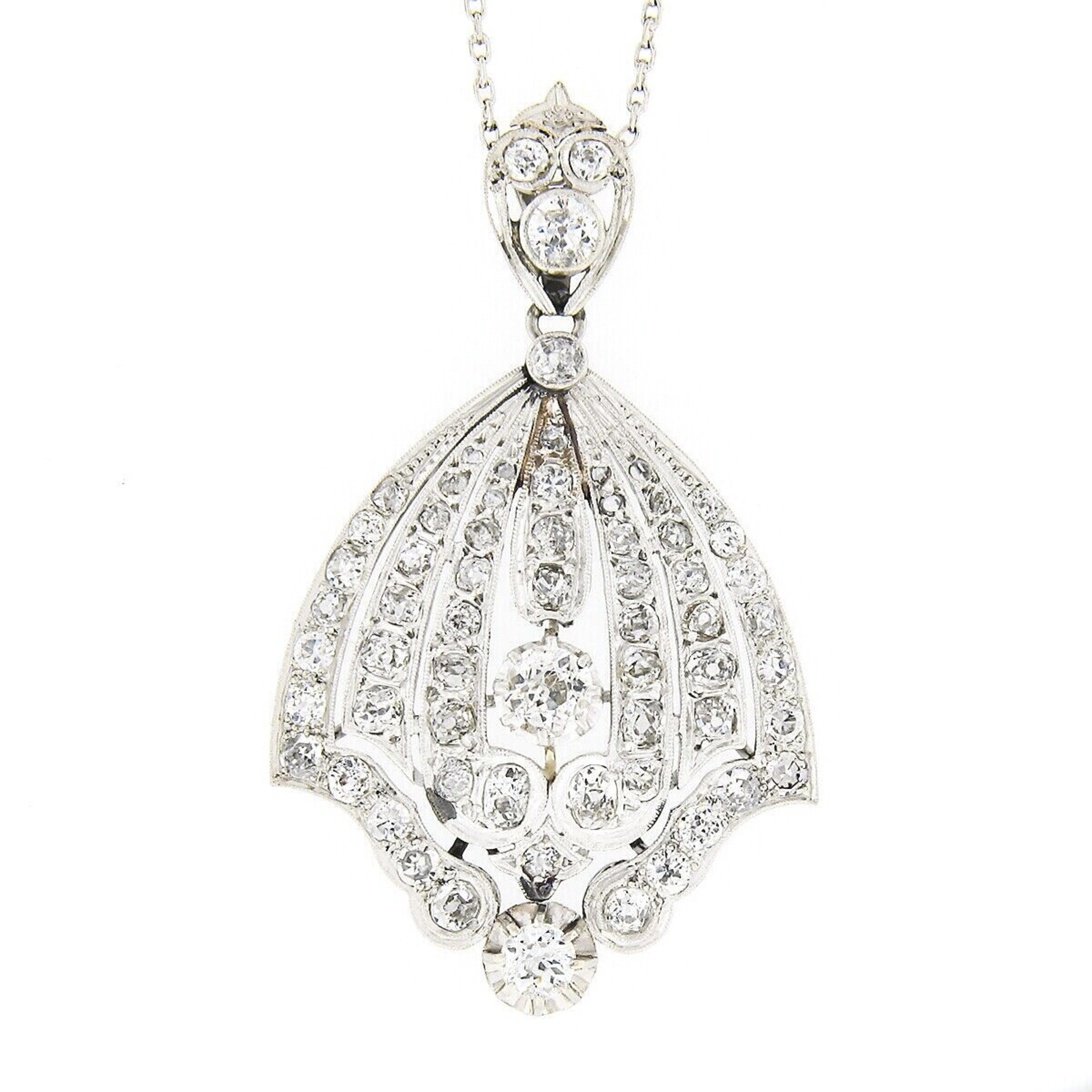 Here we have an absolutely breathtaking antique pendant that was crafted from solid platinum during the Belle Epoque period. This large pendant features an elegant, wide, flared design with subtle open work and is completely drenched in fine