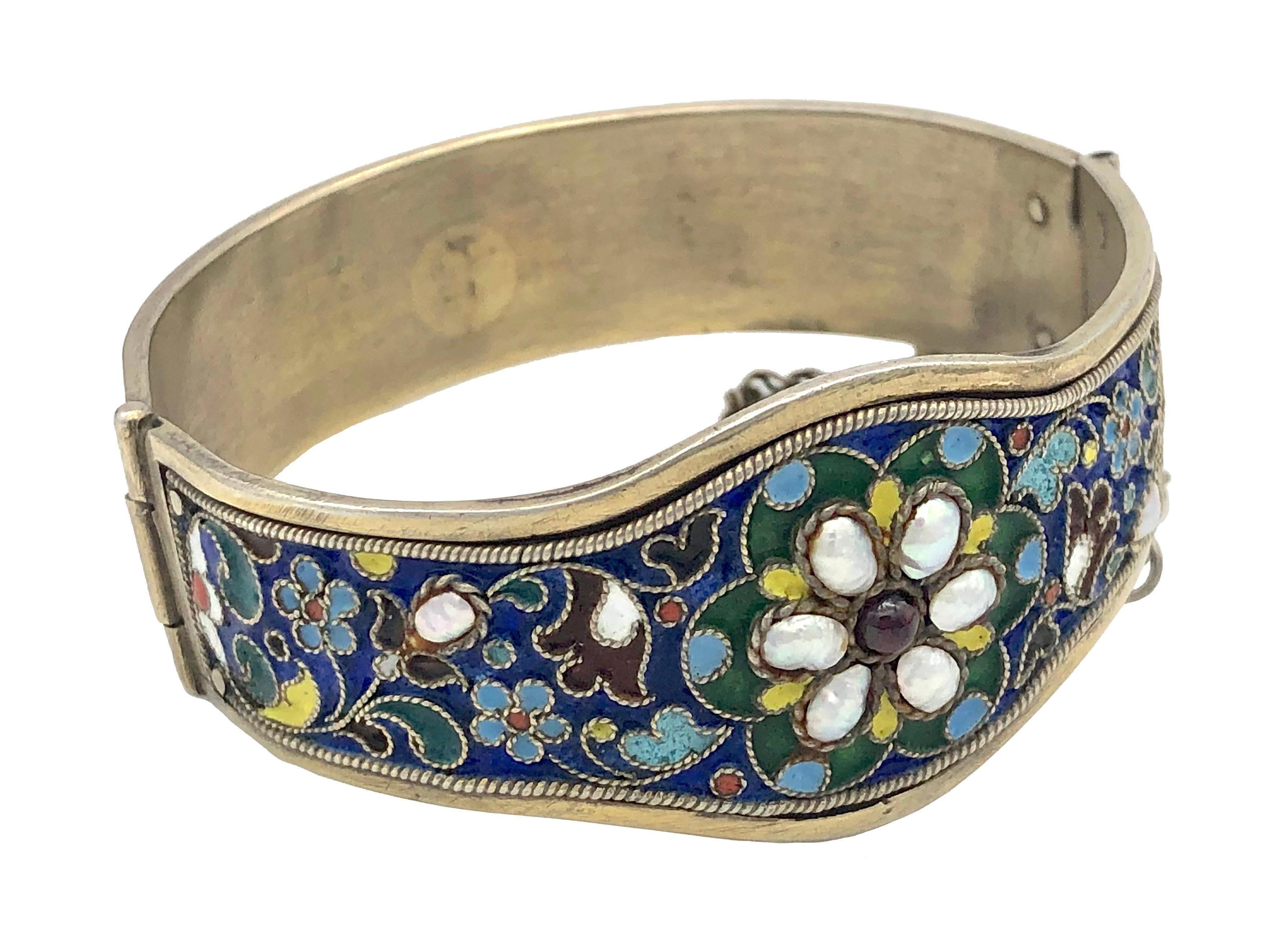 This magnificent bangle is a fine example of cloisonnè enamelling.