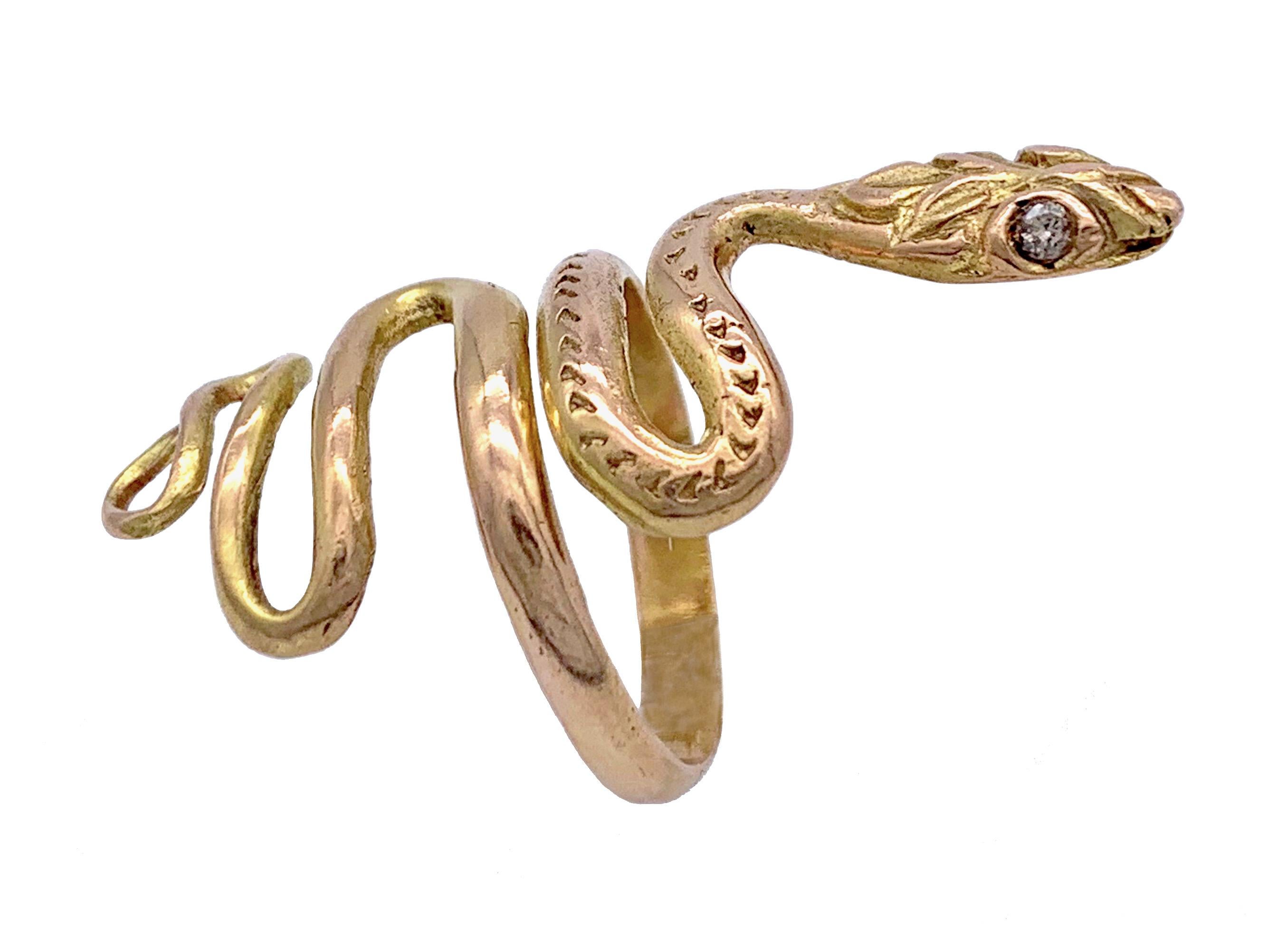 This unusual engraved Belle Époque snake ring will coil around most fingers. It was made in the 1880`s in Italy out of 10 karat gold. Two small diamonds give sparkle to the snake's eyes. 