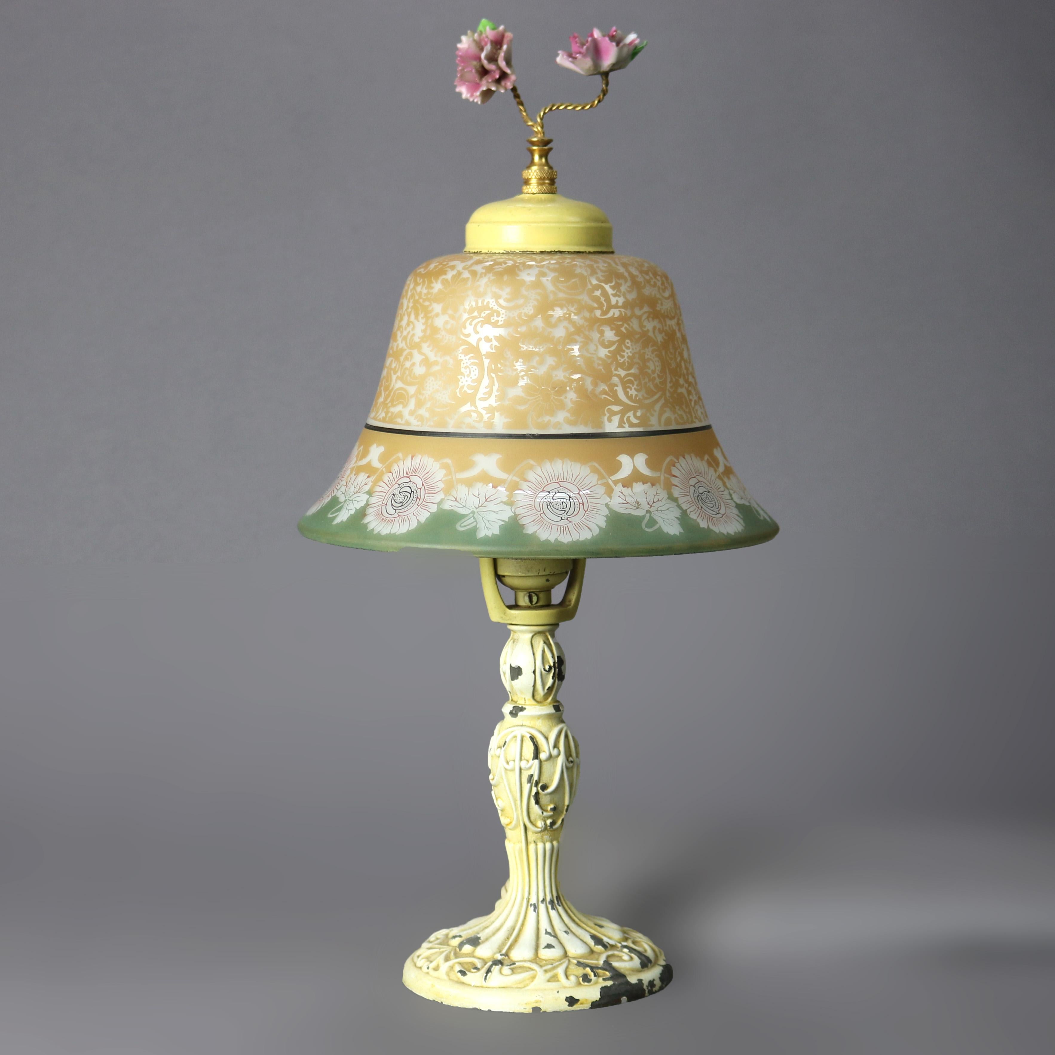 An antique Art Deco boudoir lamp by Bellova offers glass shade with floral band over single socket painted base, circa 1920

Measures - 15.75