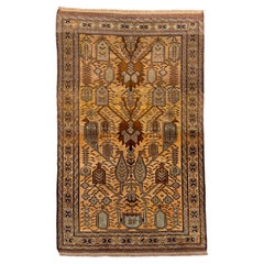 Antique Belouch Rug with Bold Tribal Motifs in Golden Ochre 
Earth Tones
