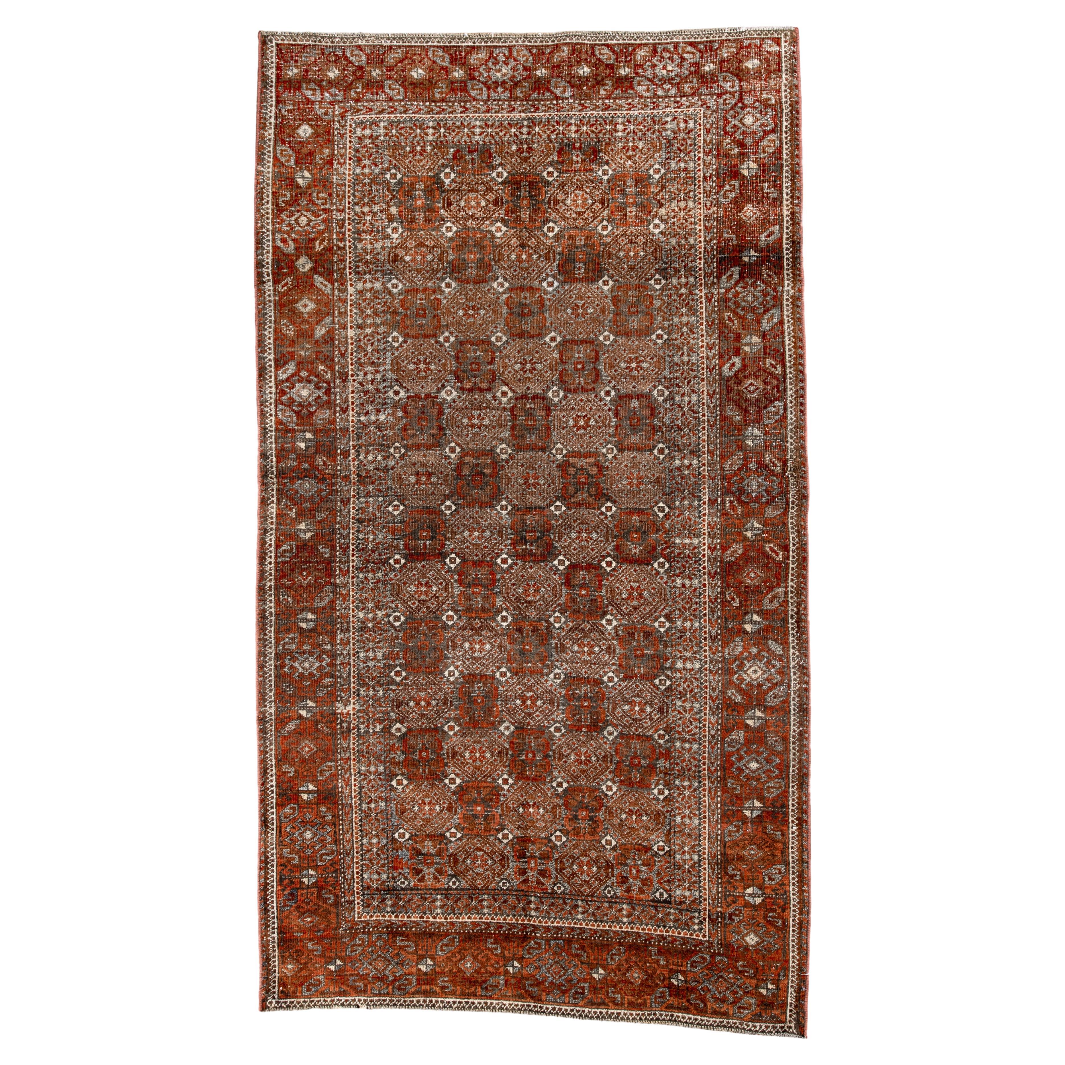 Antique Belouch Rug with Repeating Gul Pattern For Sale