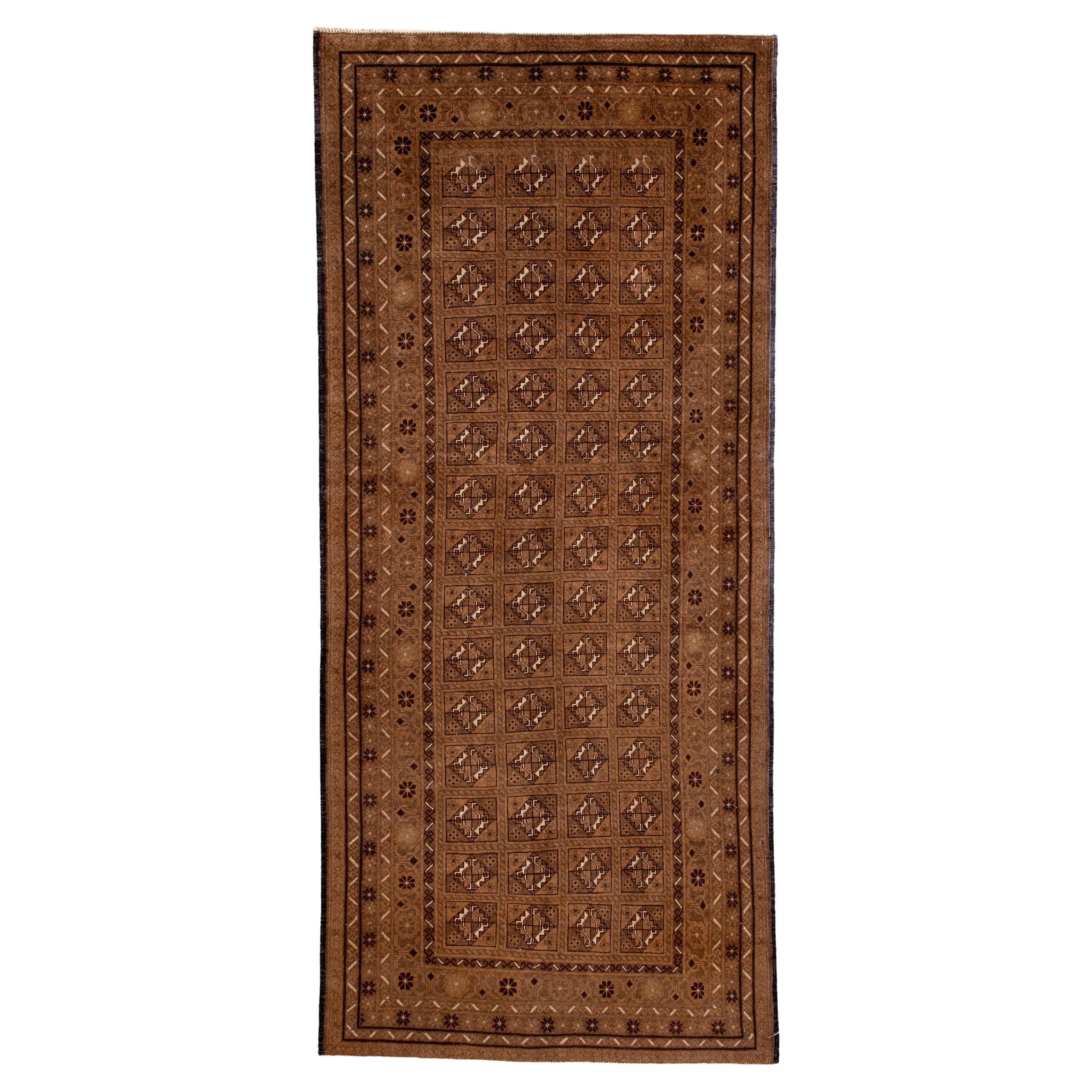 Antique Belouch Runner with Repeating Gül Grid in Warm Walnut 
Camel For Sale