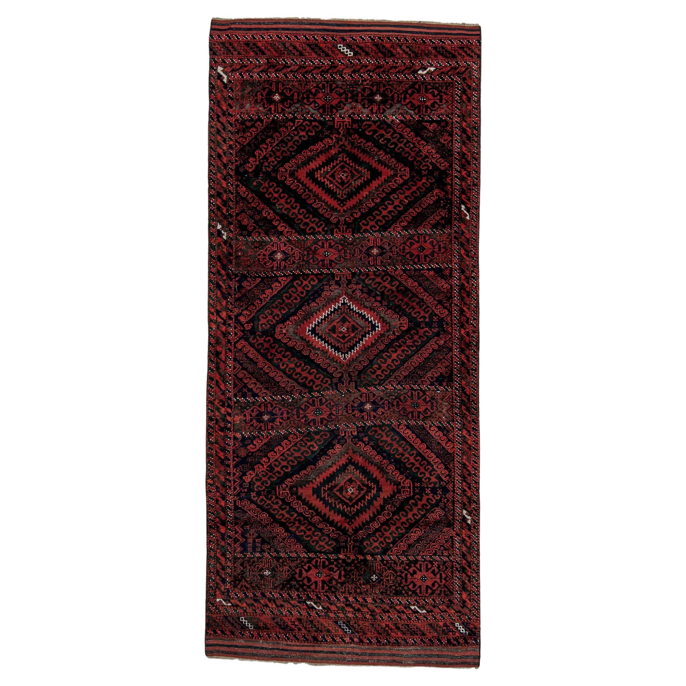 Alfombra tribal antigua Belouch - Diseño de medallón de diamantes carmesí y añil intenso