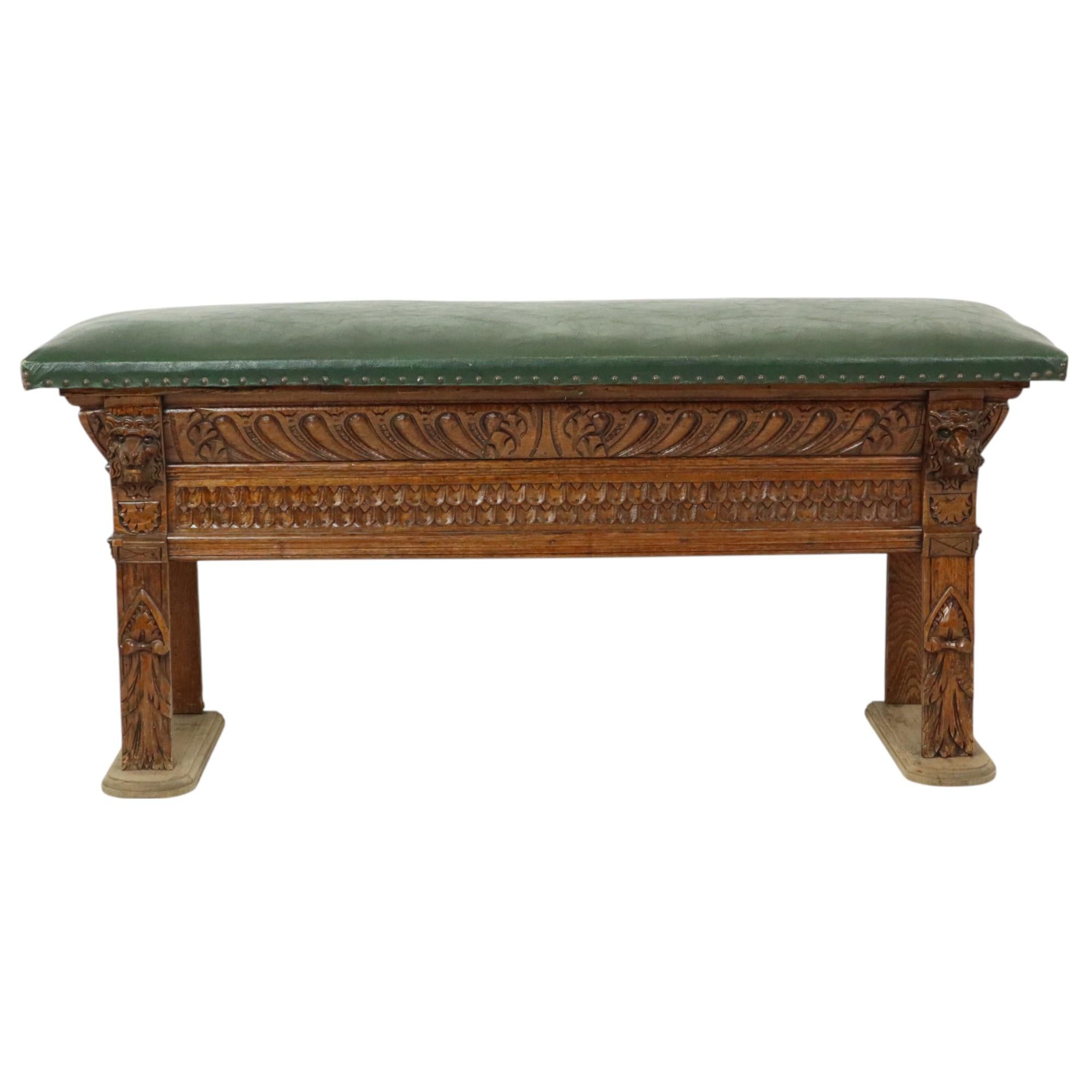 Beautiful antique bench, made of carved oak, with a green vinyl seat, this object probably comes from a church, Renaissance Revival style, circa 1890.

Unique bench, gracefully and elegantly decorated with patterns, acanthus leaves and lion heads,
