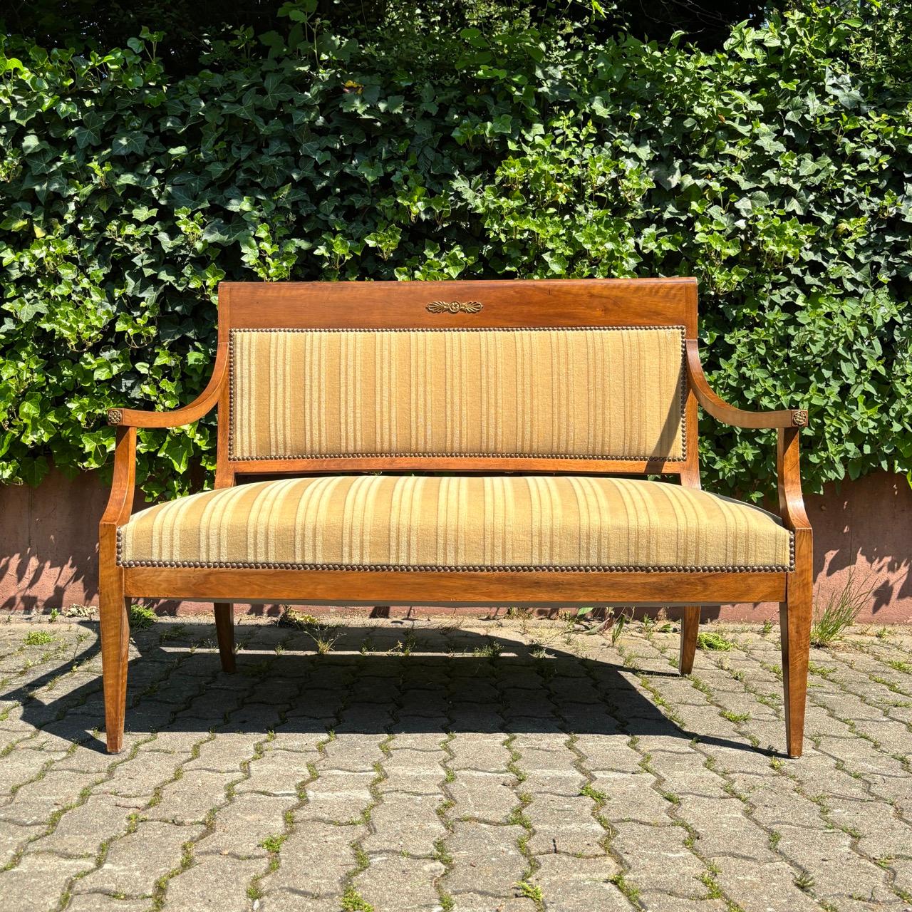 ✓ Simple elegance
✓ Dainty & timeless
✓ High-quality workmanship

Dimensions: W: 125cm H: 96cm D: 66cm

Article: Antique bench seat
Item no.: 928
Epoch: Classicism around 1800
Material: Walnut
Color: Gold-brown
Condition: In good condition
Features: