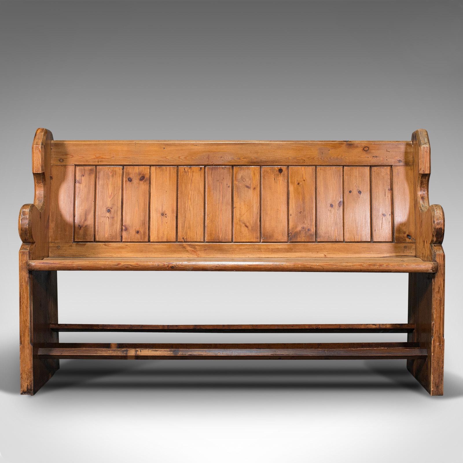 This is an antique bench seat. An English, pine three-seat pew with ecclesiastic taste, dating to the Victorian period, circa 1900.

Relax upon this generously accommodating bench for three
Displays a desirable aged patina throughout
Victorian