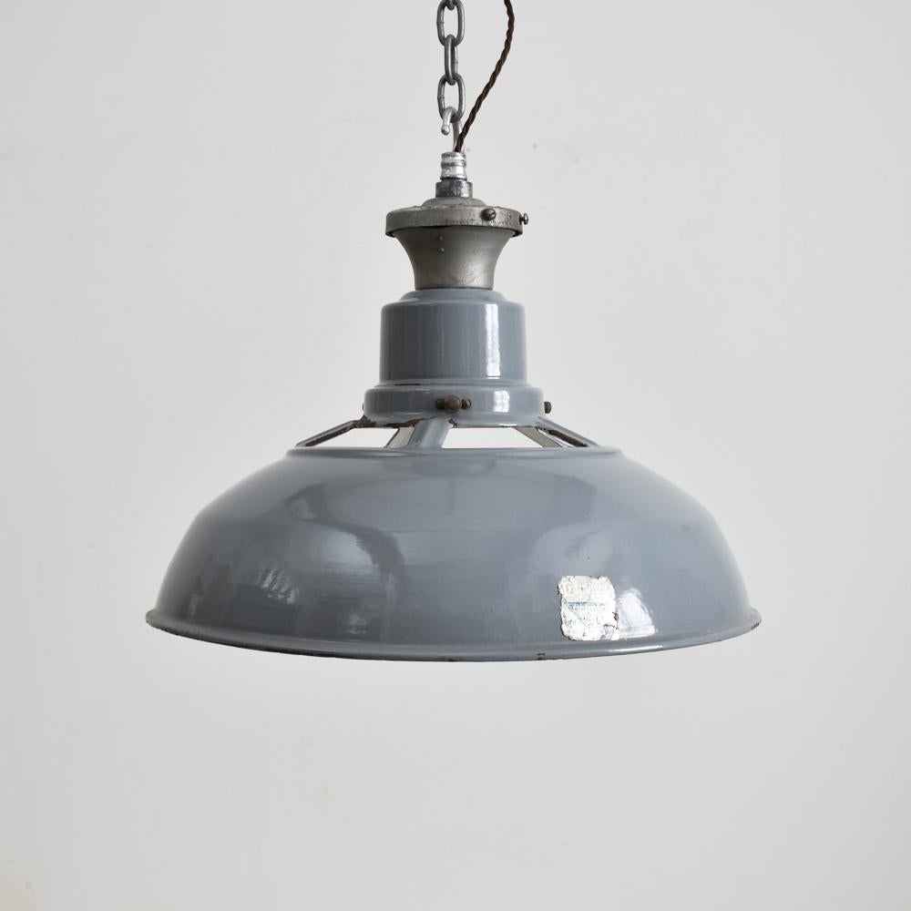18? Grey vented Benjamin industrial pendant light.

Iconic enamel Benjamin factory light shade by Benjamin Crysteel. Vitreous glass grey enamel shades, original type X galleries embossed with manufacturers name. These are becoming a rare and