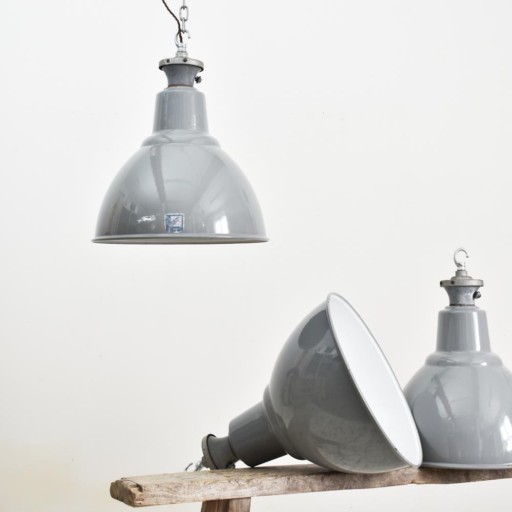 16? Grey dome Benjamin industrial pendant light.

Iconic enamel Benjamin factory light shade by Benjamin Crysteel. Vitreous glass grey enamel shades, original type X galleries embossed with manufacturers name. These are becoming a rare and sought