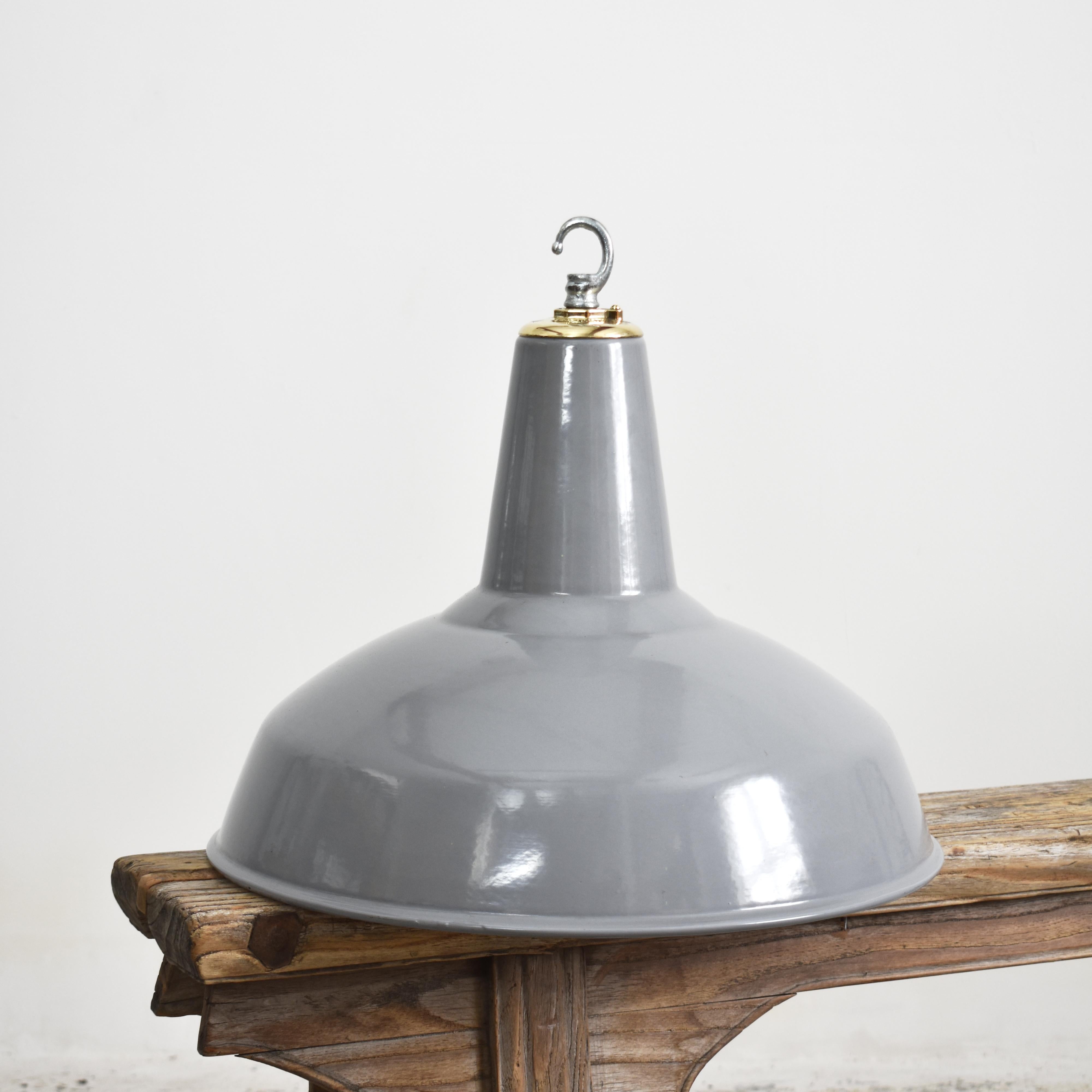 18″ Antique Industrial Grey Factory Pendant Light By Benjamin -A

A large iconic industrial factory light shade manufactured by Benjamin Crysteel. The light shade is a spun vitreous glass grey enamel pendant and has retained its original brass X