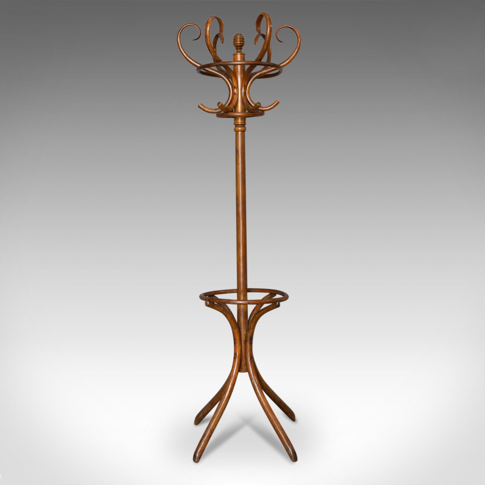 This is an antique bentwood coat rack or hall stand in the Thonet café taste. An English, beech hall hat, coat, stick and umbrella stand dating to the early 20th century, circa 1910.

Displays good colour throughout and a desirable aged