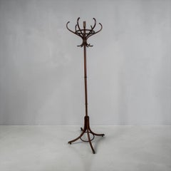 Antique bentwood coat rack (or hat stand) made of dark-stained wood.