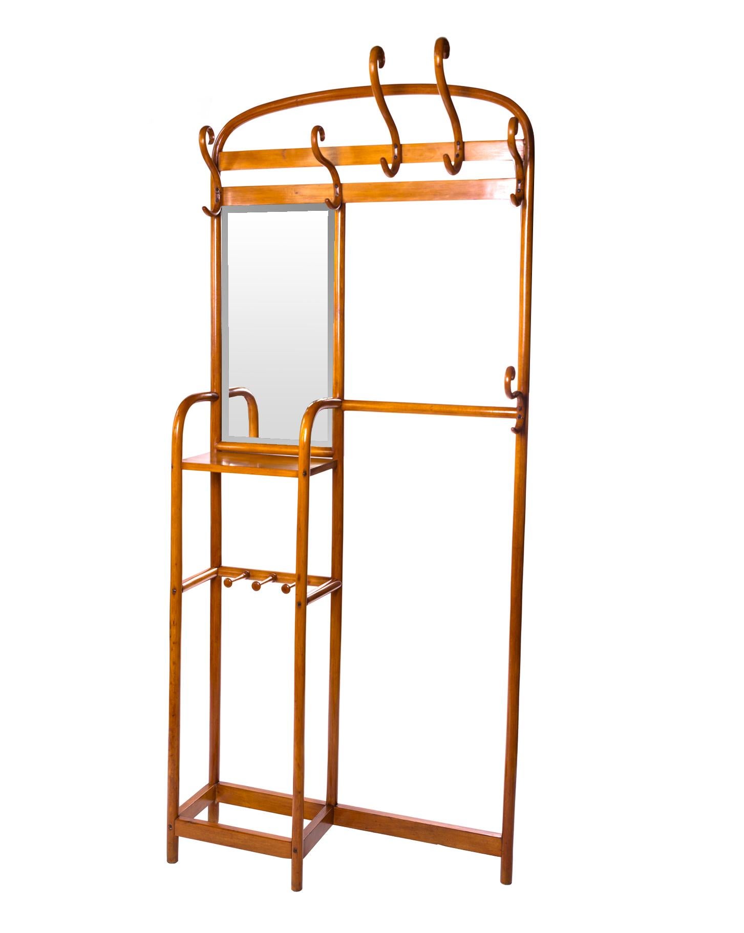 A large wooden, wall-mounted wardrobe with hangers and a mirror. Original, signed on the back. The innovative design allows the furniture to be included as iconic examples of applied art in the first half of the 20th century.
The dressing room was