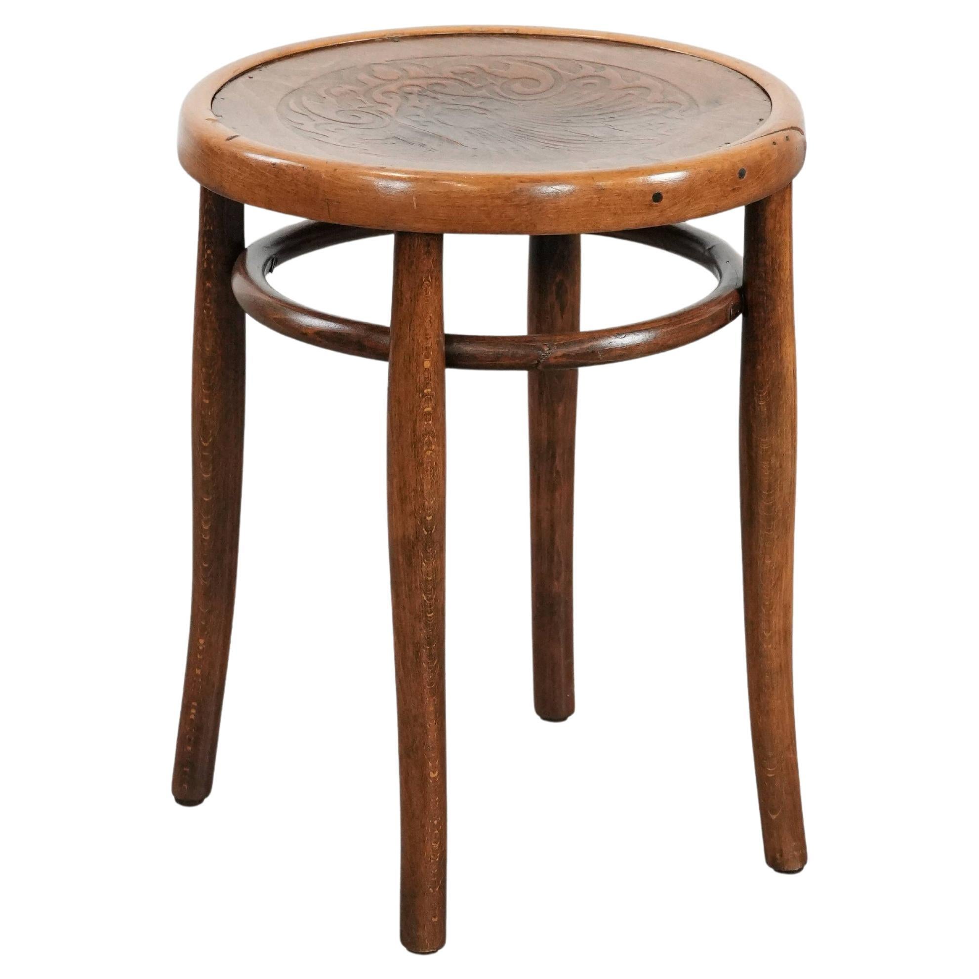 Antique bentwood stool from early 1900s with a seat with beautiful details