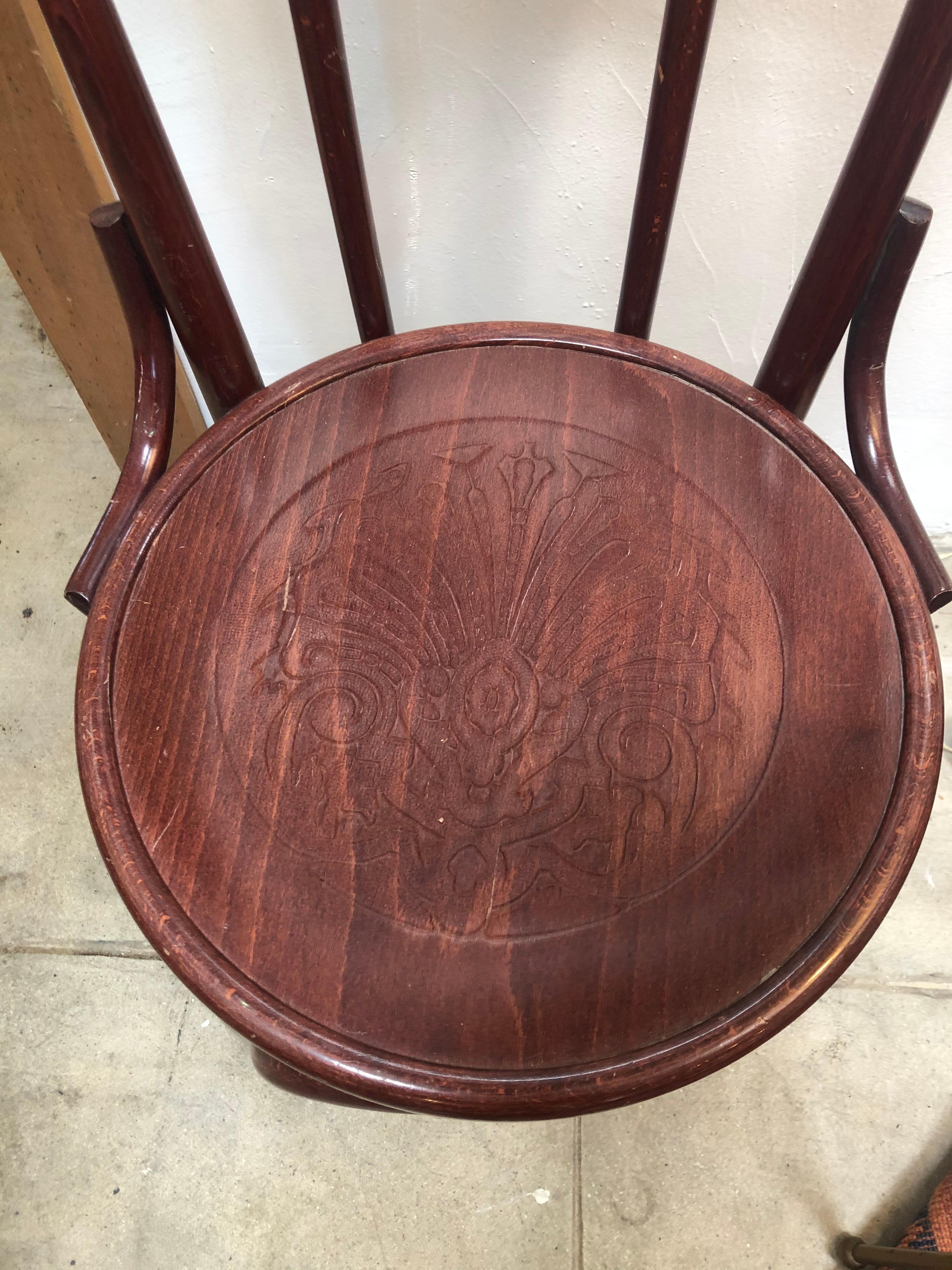 Antique bentwood chair from the early 1900s in Europe. Rose/Walnut color with ornate detail in the seat. Would work well with eclectic dining table set up or desk chair.
