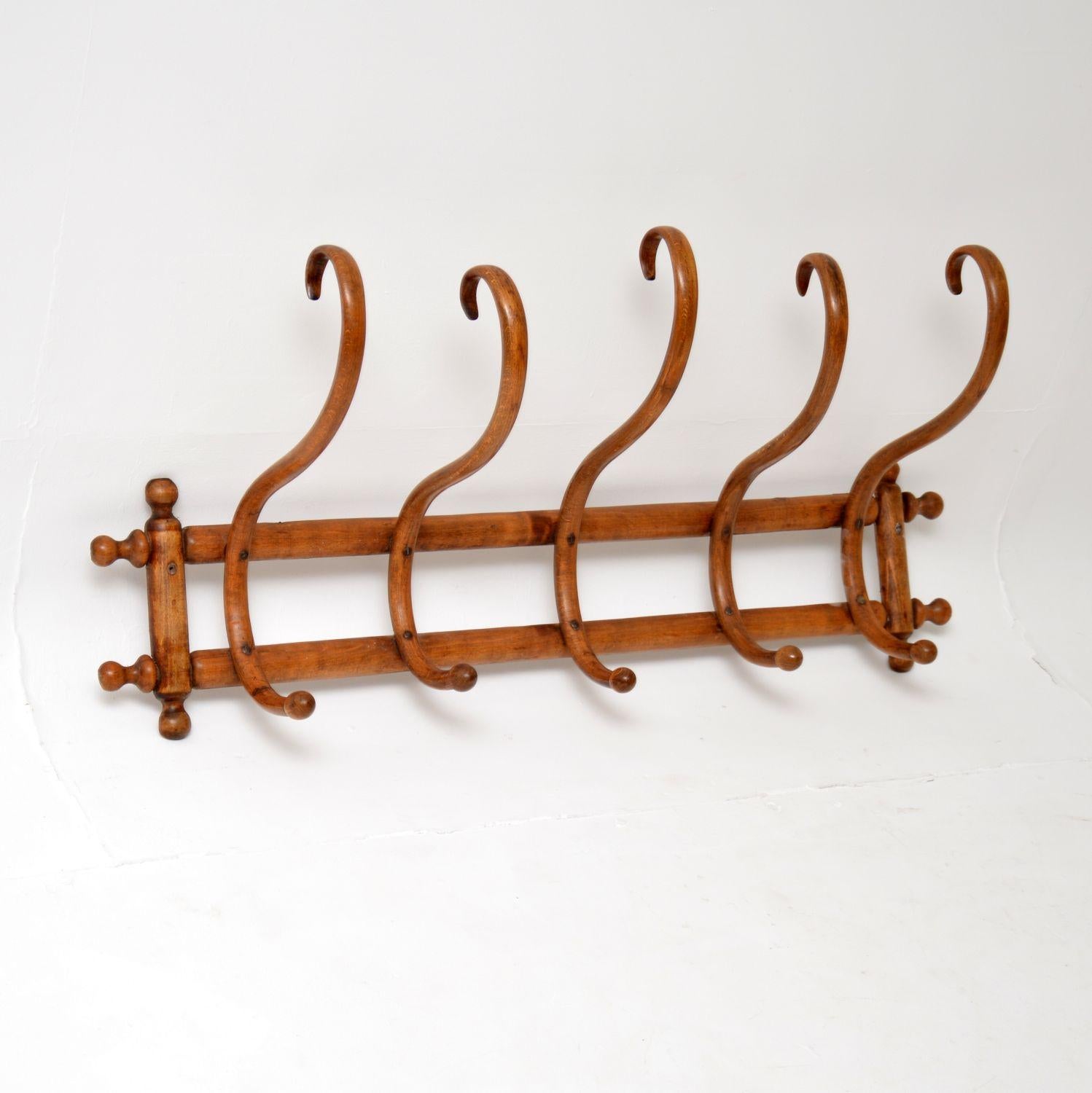 An excellent antique bentwood wall mounting hat and coat rack. Most likely made by Thonet in Austria, this dates from around the 1900 period.

It is a charming and useful item, with plenty of character.

We have recently had this re-polished, it