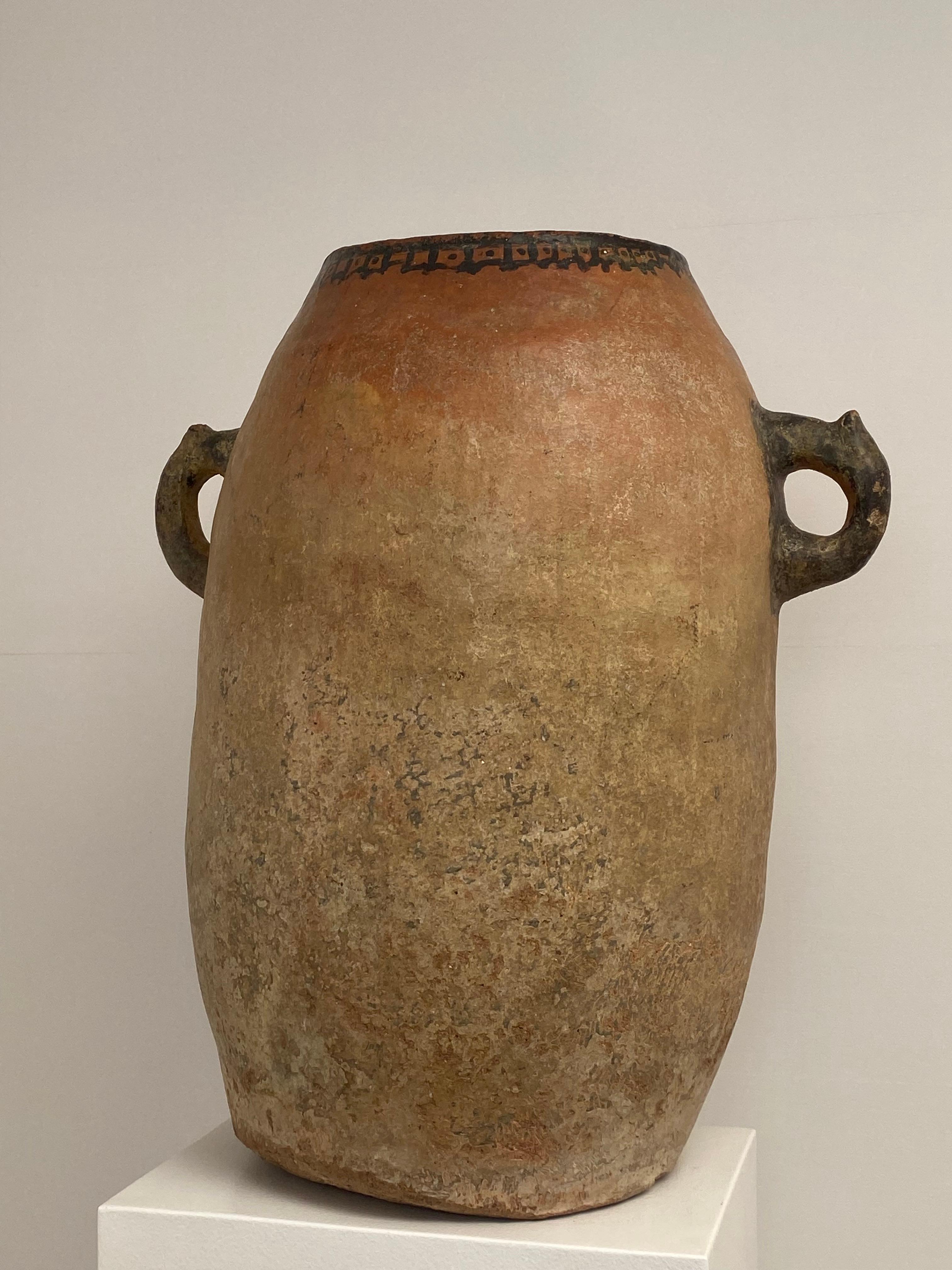 Tall Terracotta Vase from Morocco, Berber origin, early 19 th Century,
the vase has a very beautiful Patina, nice Beige-Brown color and shine,
the urn is a little decorated a the top,
very decorative object 