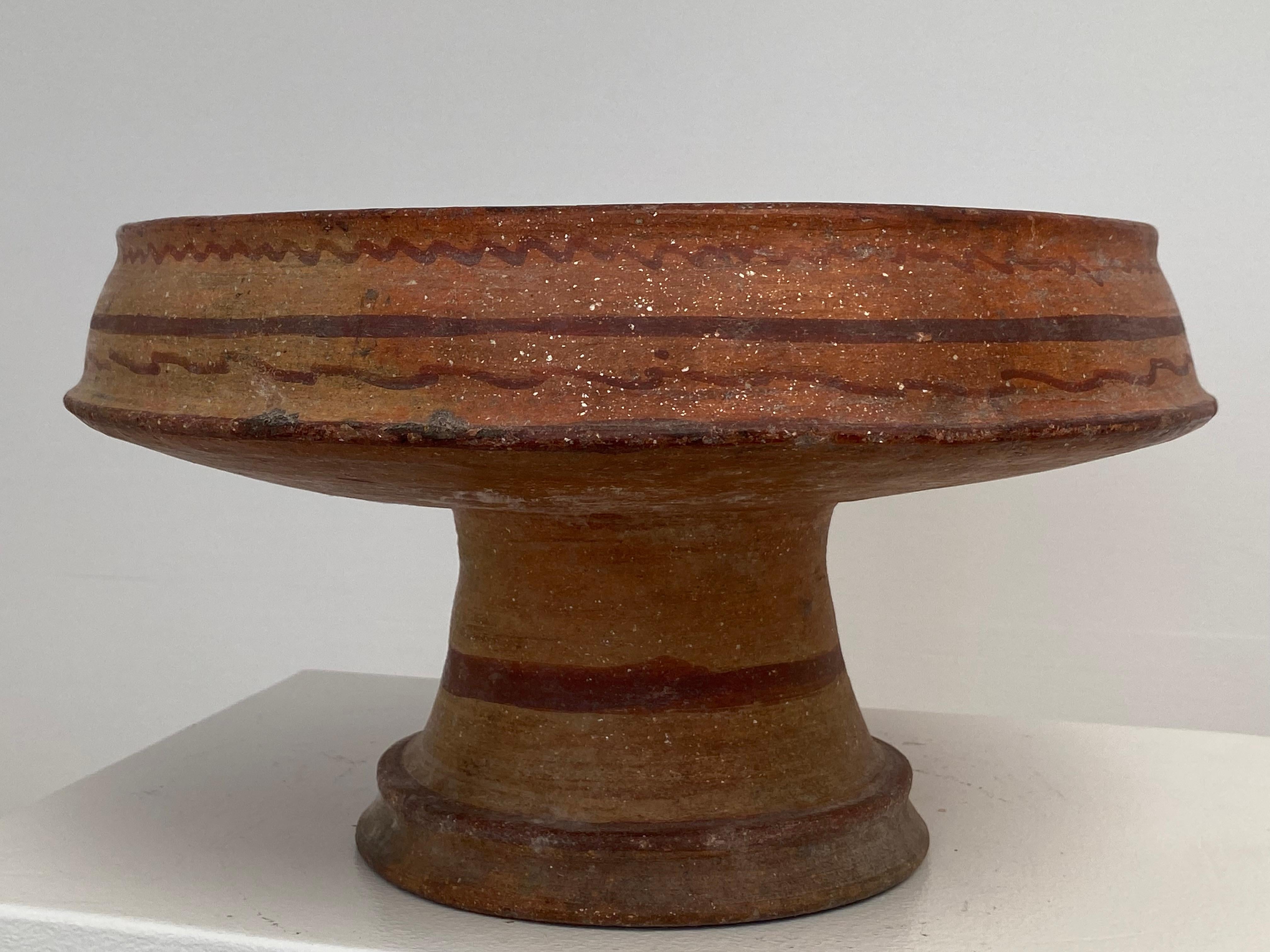 Very Elegant and antique Berber Terracota tazza on stand,
old and beautiful patina and shine of the terracotta,
horizontal Brown and Red lines used as decoration,
very decorative object that can be used for different purposes