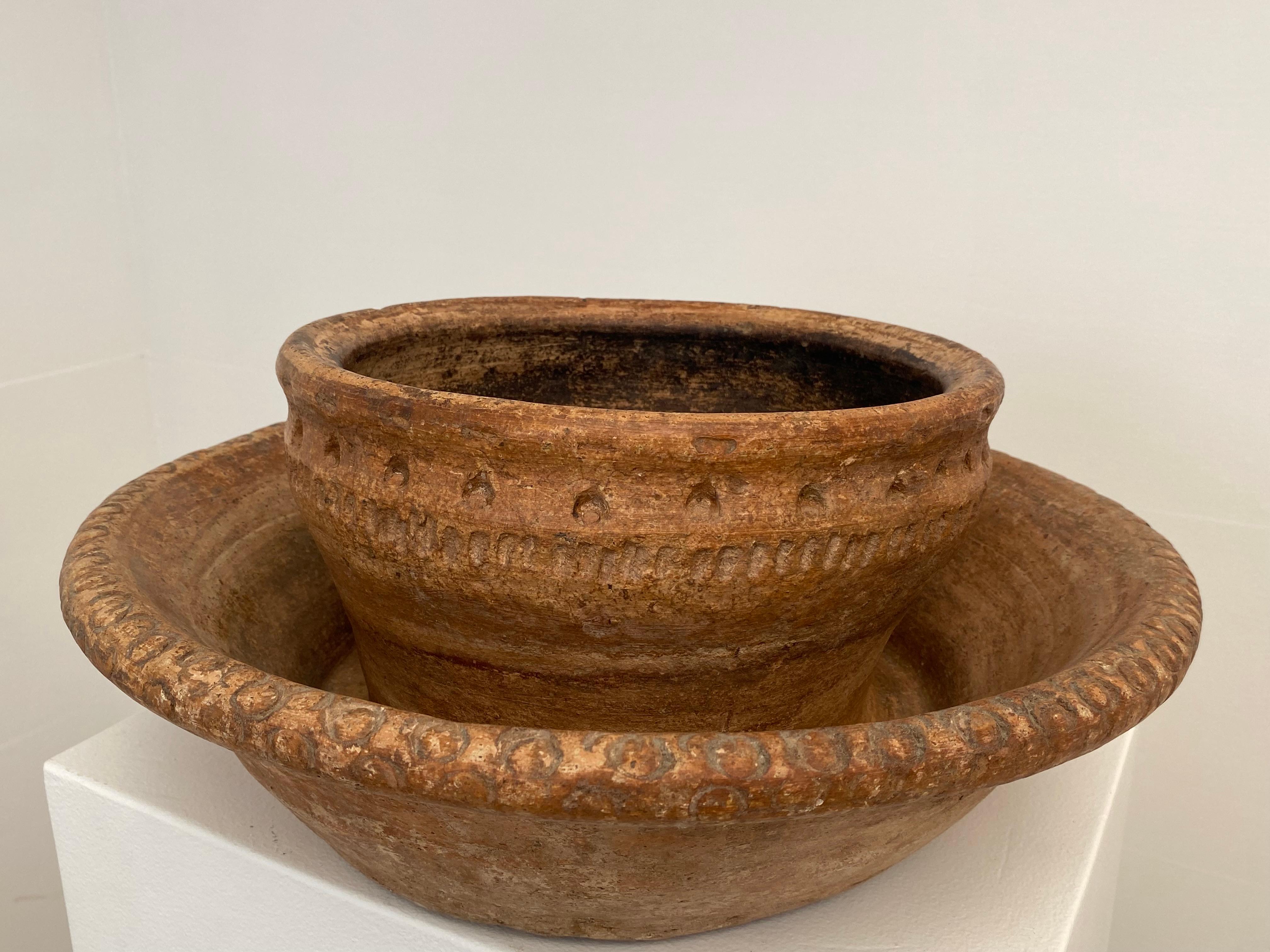 Exceptional Moroccan Terracotta' Bowl in Bowl ' ,   
used for washing hands, from the RIF mountains in the Northern part of Morocco,
good,old great Patina and Shine of the terracotta,
very decorative object