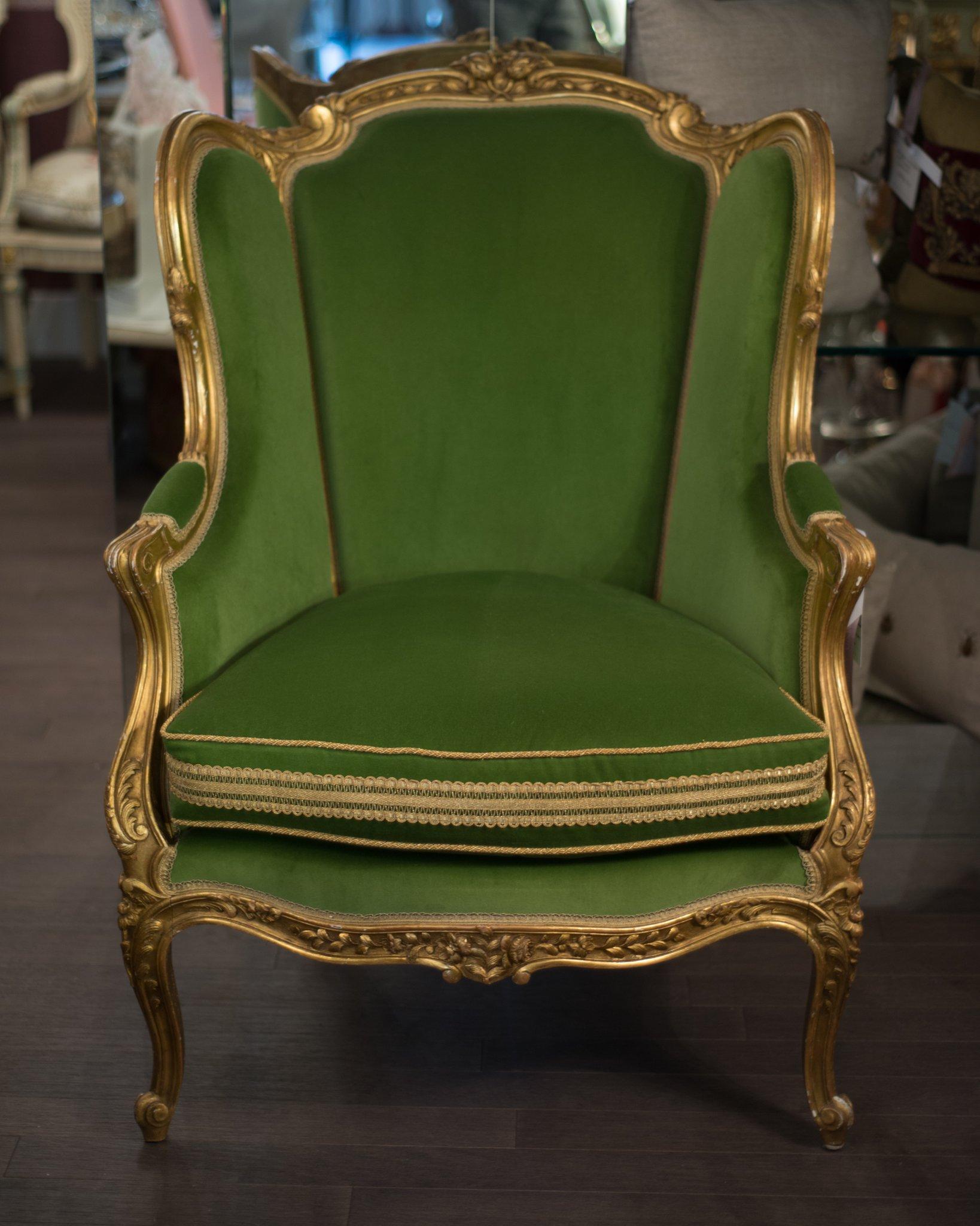 This elegant and comfortable French antique Bergère chair is expertly reupholstered by a master upholsterer in a vibrant and modern shade of green cotton velvet and finished with French metallic trim.