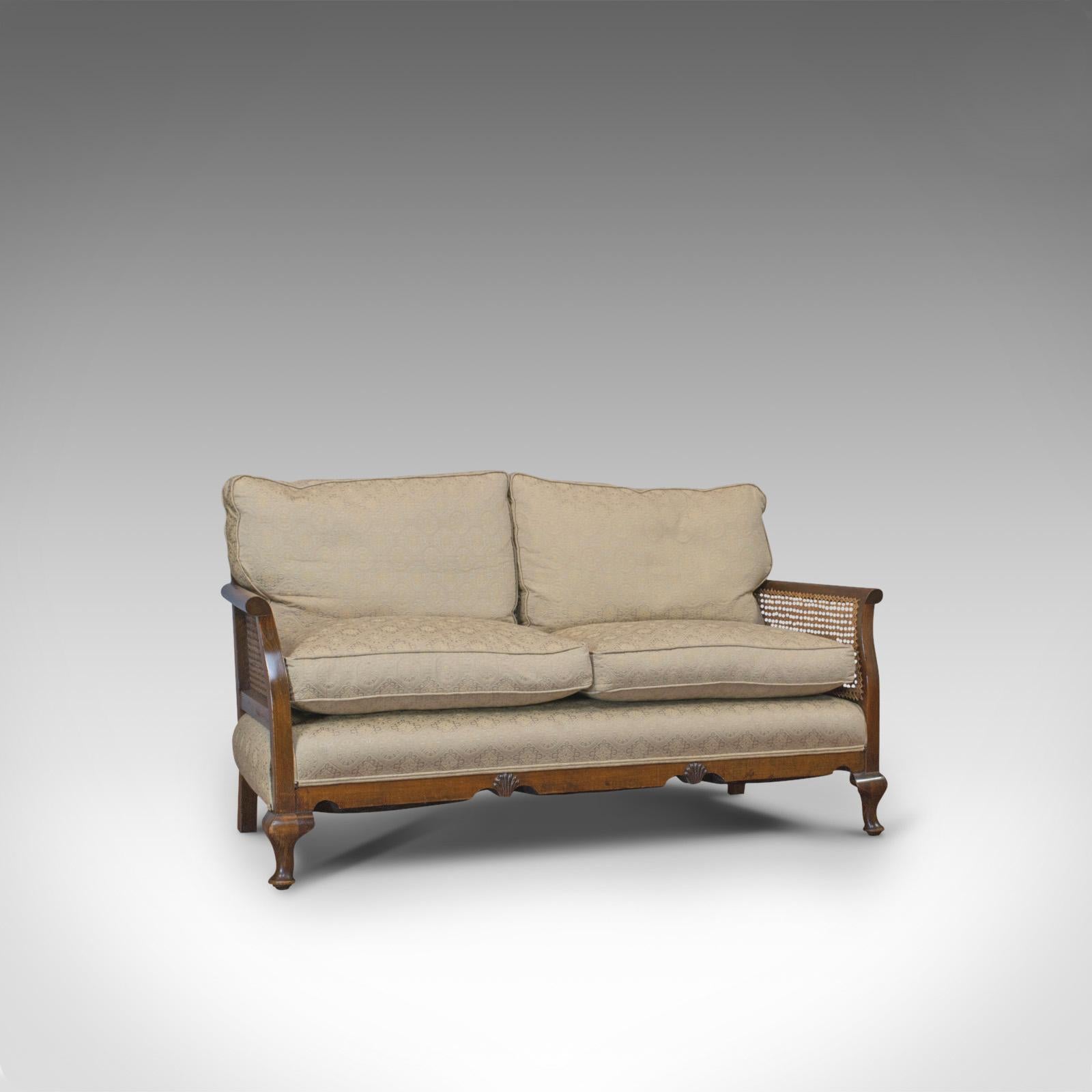 This is an antique bergere suite. An English, beech and cane chair and sofa set, dating to the Edwardian period, circa 1910.

An elegant suite of fine form and upholstery
The whole displays a desirable aged patina
Generous beech frame with fine