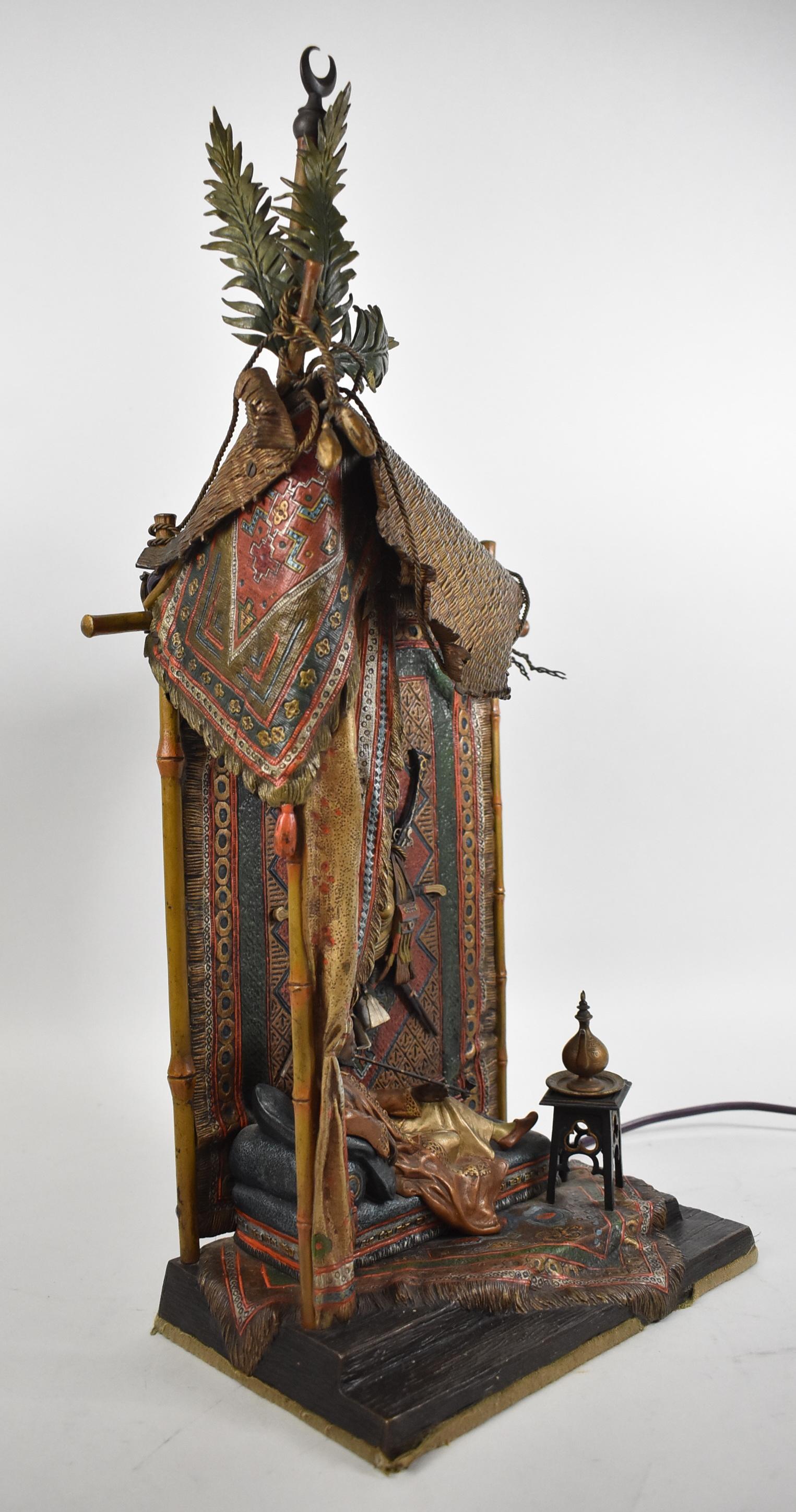 Antique Franz Xavier Bergman 1861-1936 Austrian cold painted bronze Orientalist carpet seller lamp. Full figured Arab gentleman enjoying a pipe. Detailed oriental carpets on floor and wall.