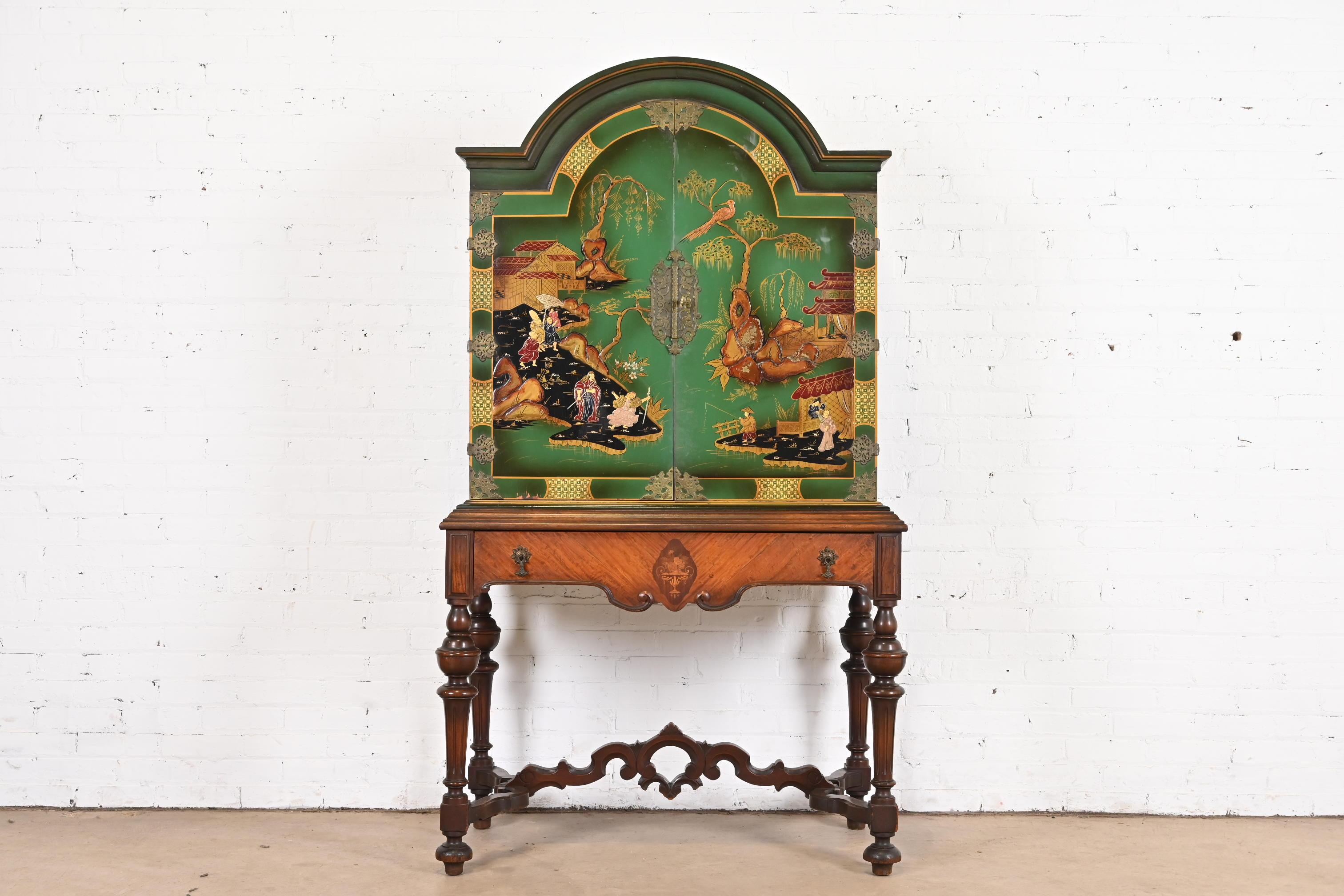 An exceptional Chinoiserie Jacobean style bookcase, dining cabinet, or bar cabinet

By Berkey & Gay

USA, 1920s

Carved walnut, with painted Chinoiserie scenes, and original brass hardware.

Measures: 40.5