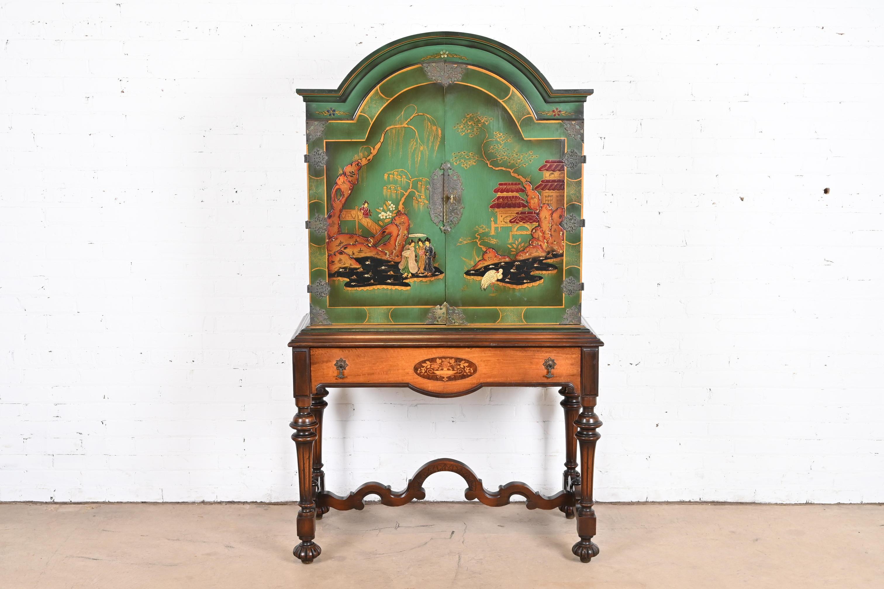 An exceptional Chinoiserie Jacobean style bookcase, dining cabinet, or bar cabinet

By Berkey & Gay

USA, 1920s

Carved walnut, with painted Chinoiserie scenes, and original brass hardware.

Measures: 41.25