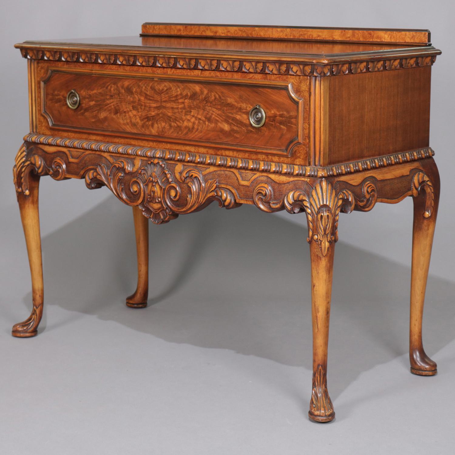 Antique Berkey & Gay Queen Anne style server features flame mahogany case with low backsplash and carved foliate trimming, bookmatched long drawer, and seated on cabriole legs with carved knees, Berkey & Gay label inside drawer, 19th