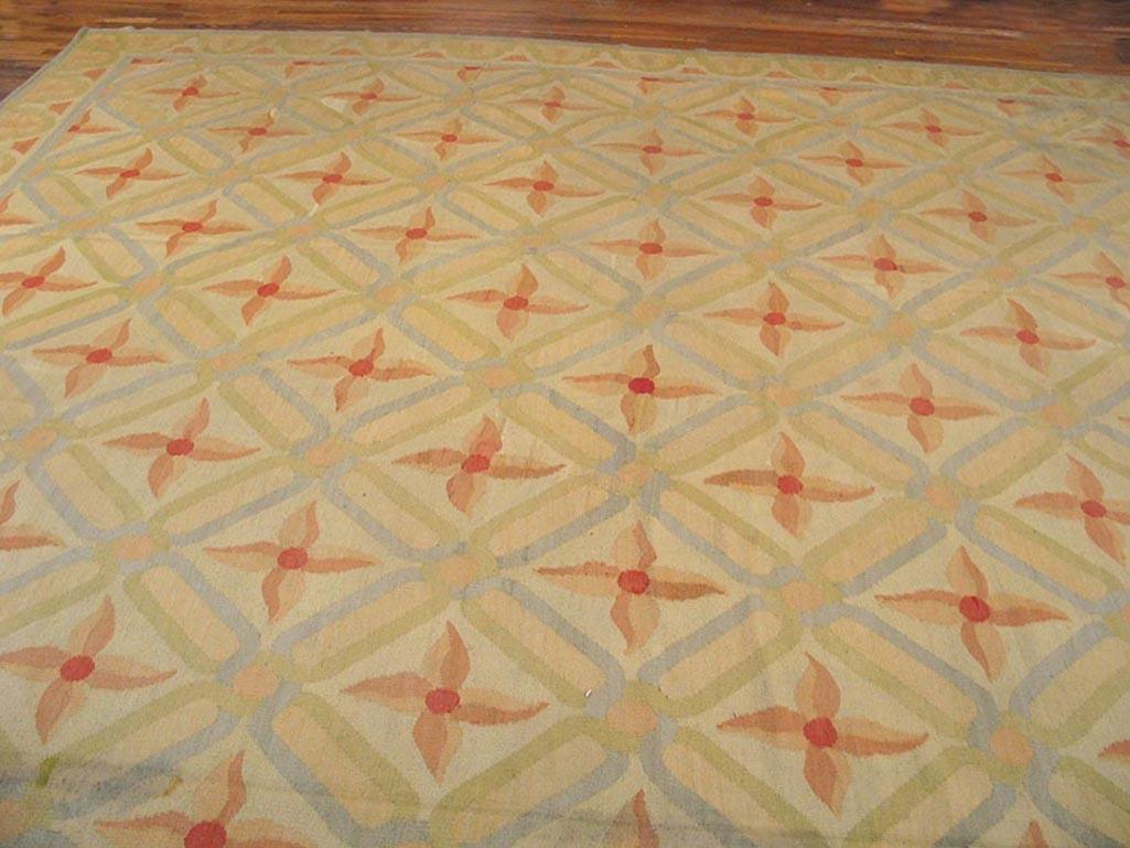 Besserabian Tapestry-woven Palace carpet
This enormous antique Moldovan carpet is a stuffy in the artistic use of yellow: as a field tone in an all-over diamond lattice, each unit enclosing a two-tone pinwheel cross; in a narrow border with