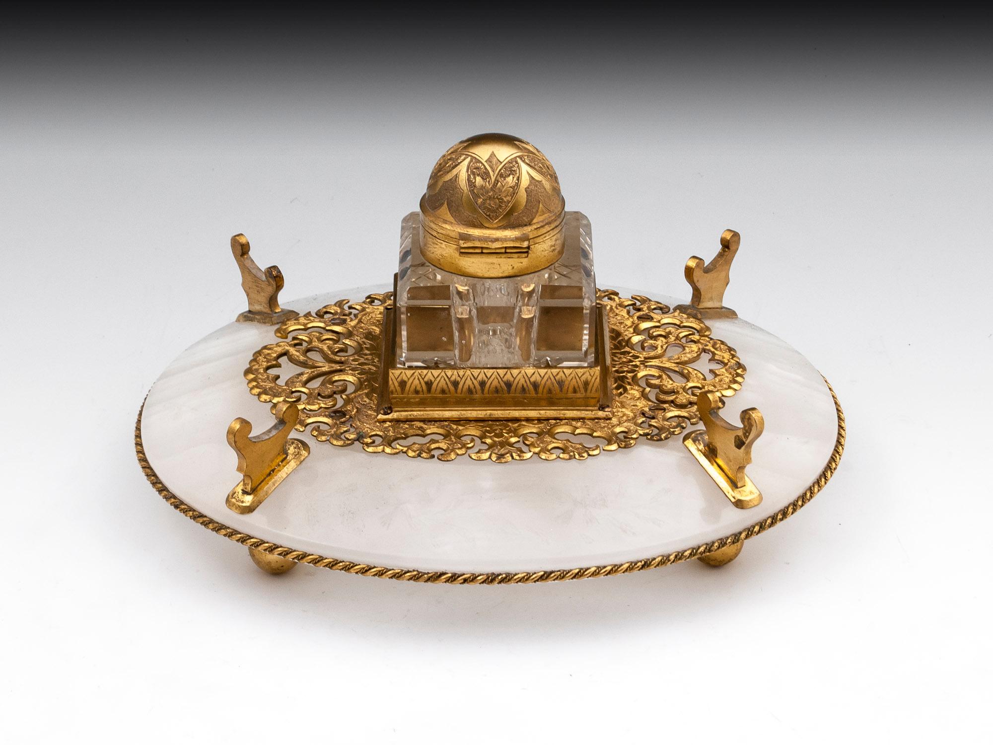 Antique partners gilded Bronze and Onyx ink stand by Betjemann. Featuring gilded pen rests, ornate engraved bracket and inkwell lid. The Onyx is also engraved with floral pattern. 

The inkwell lid is stamped: Betjemann, Patent 11043, 3443 and
