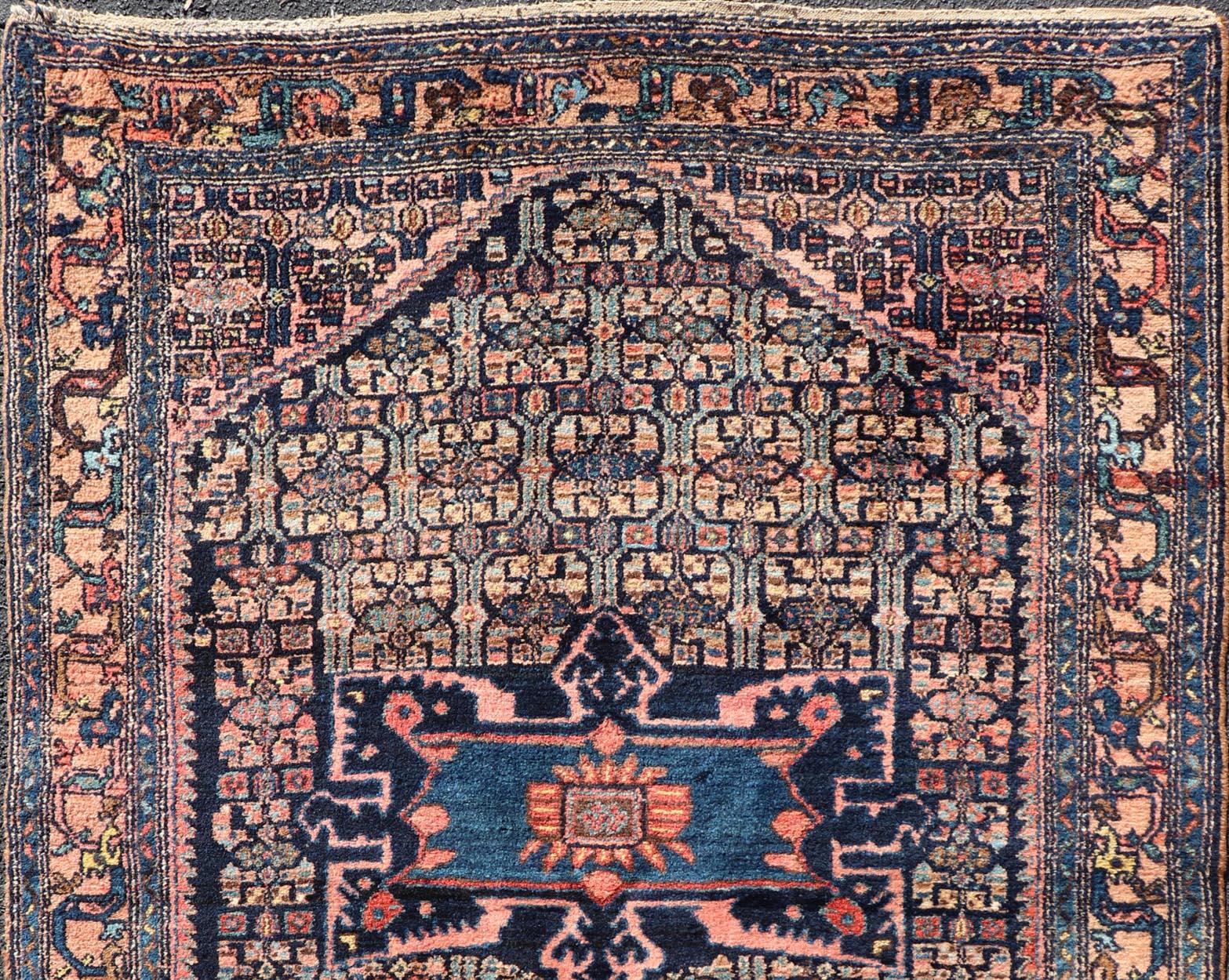Blue, dark blue, pink, and tan Bibiakabad antique rug Persian, Keivan Woven Arts / rug W22-0103, country of origin / type: Iran / Bibiakabad , circa 1920.


Measures: 4'6 x 6'7.