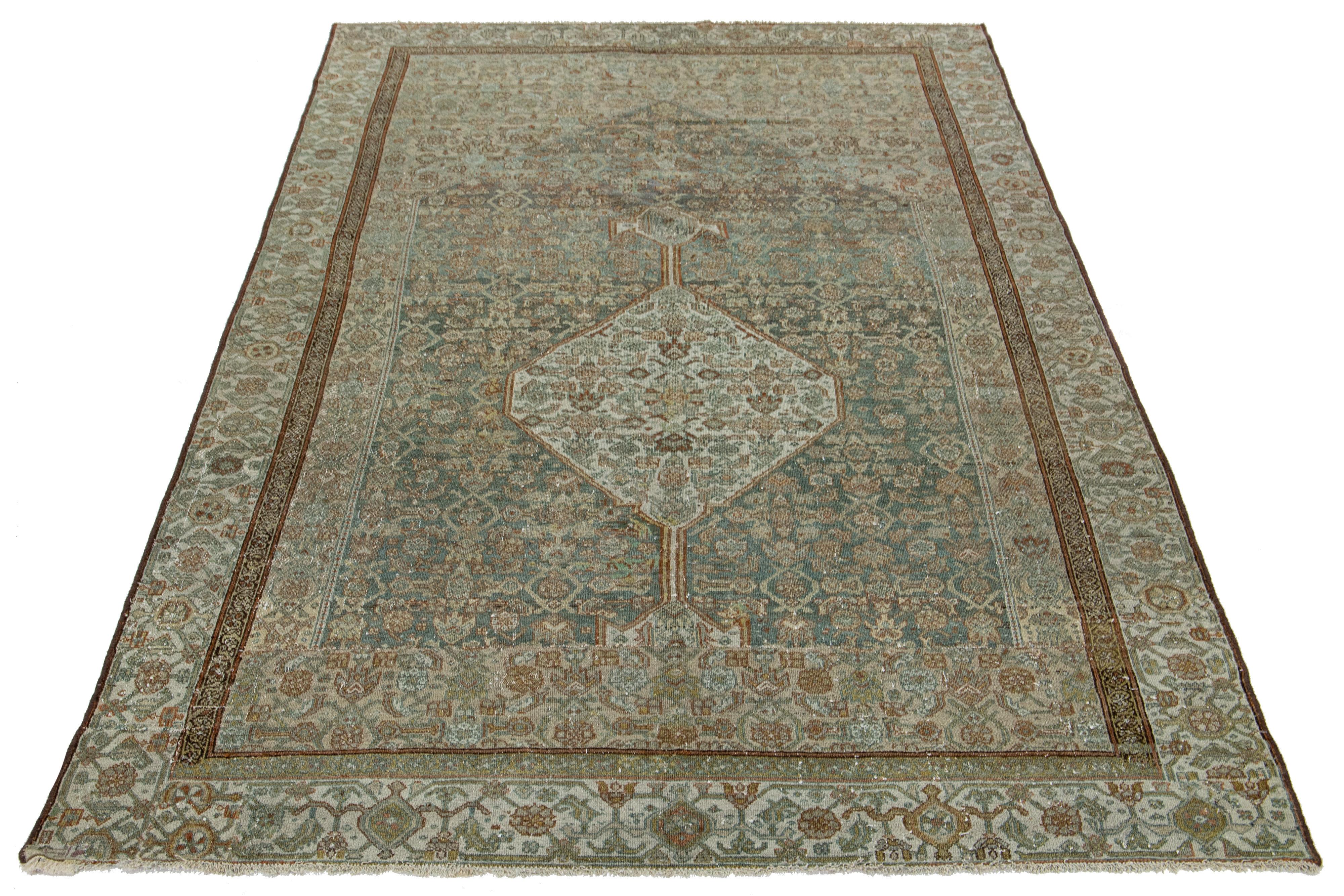 Beautiful antique Bibikabad hand-knotted wool rug with a blue field. This piece has a designed frame with beige and brown accent colors on a gorgeous all-over classic floral design.

This rug measures 6' x 10'.
  
