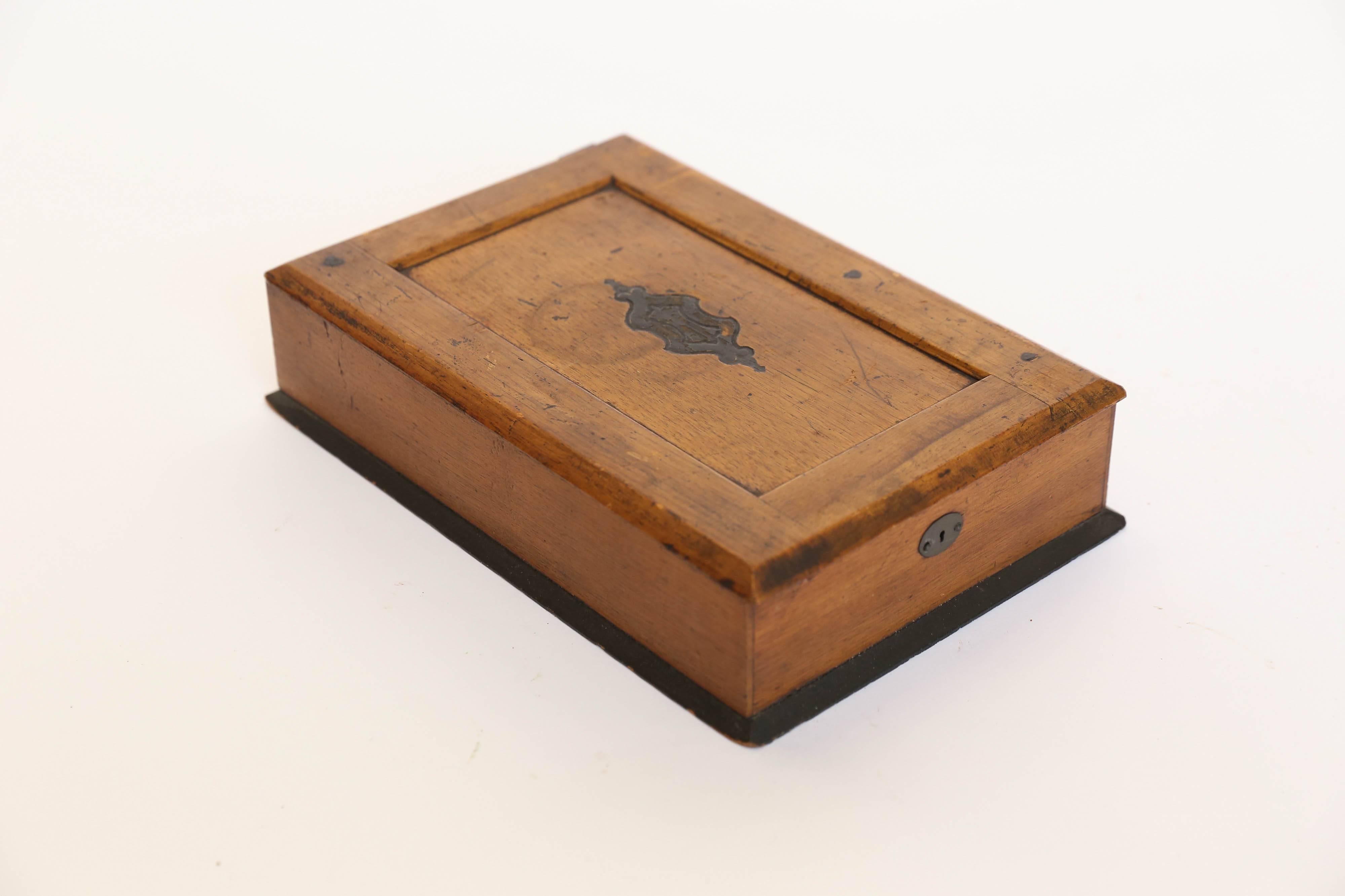 An old writing box found with a treasured bible and an exquisite pair of wire-rimmed glasses tucked neatly inside. The box is obviously earlier than the bible, which is dated 1953, while the glasses are likely the oldest item in the group. The